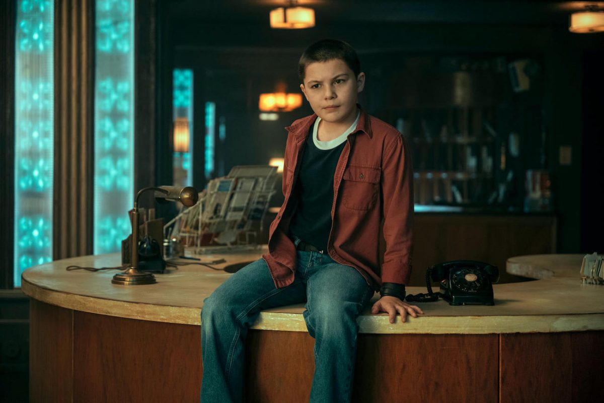 Stan (Javon 'Wanna' Walton) sits on the desk at the Hotel Obsidian in 'The Umbrella Academy' Season 3