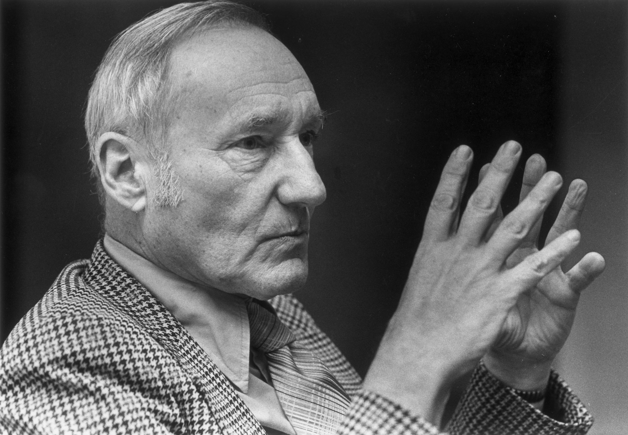 William S. Burroughs raising his hands