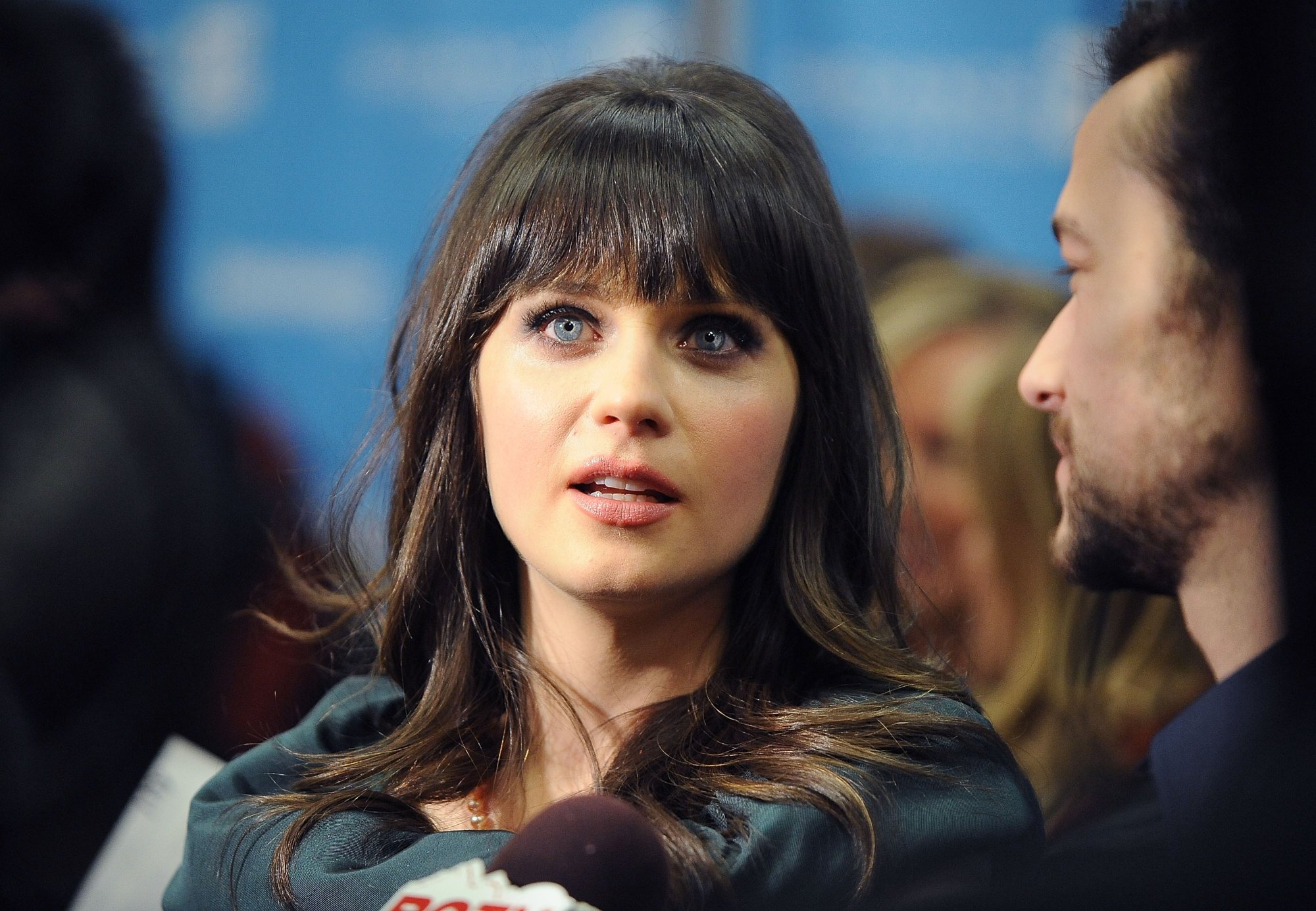 '500 Days of Summer' Zooey Deschanel at the Sundance premiere looking straight ahead with a microphone in front of her
