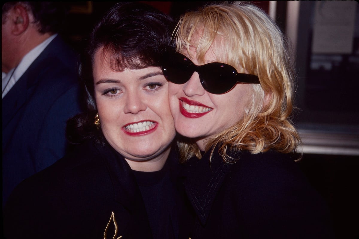 Rosie O'Donnell and Madonna smile together at the premiere of A League of Their Own