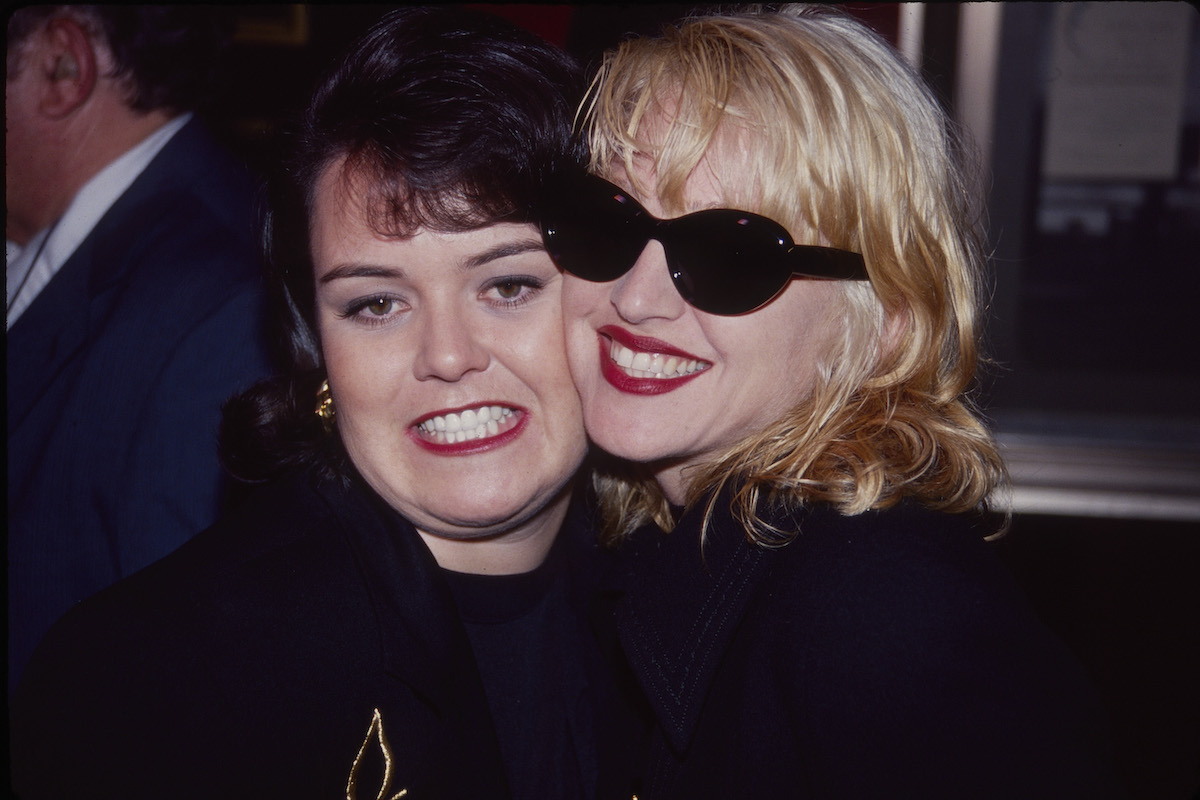 Rosie O'Donnell and Madonna smile together at the premiere of A League of Their Own