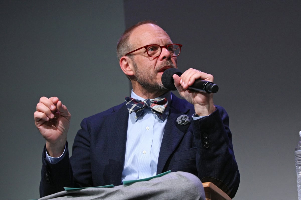 Celebrity chef Alton Brown wears a bowtie and suit in this photograph.