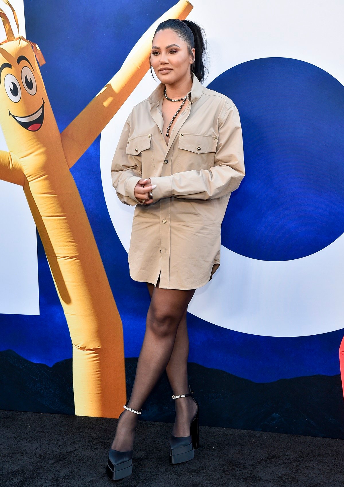 Ayesha Curry poses for a photo on the red carpet at the world premiere of Universal Pictures' NOPE