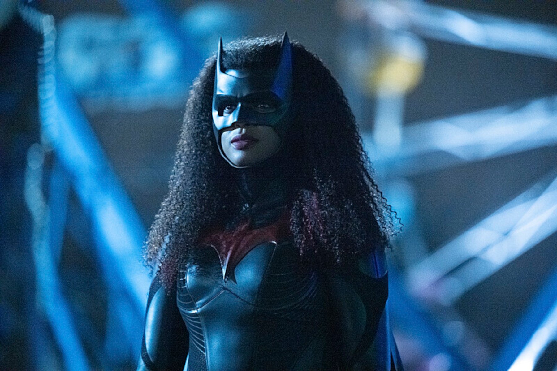Javicia Leslie in The CW's 'Batwoman,' which was canceled in 2022. She's wearing the batsuit, and her hair is curly.