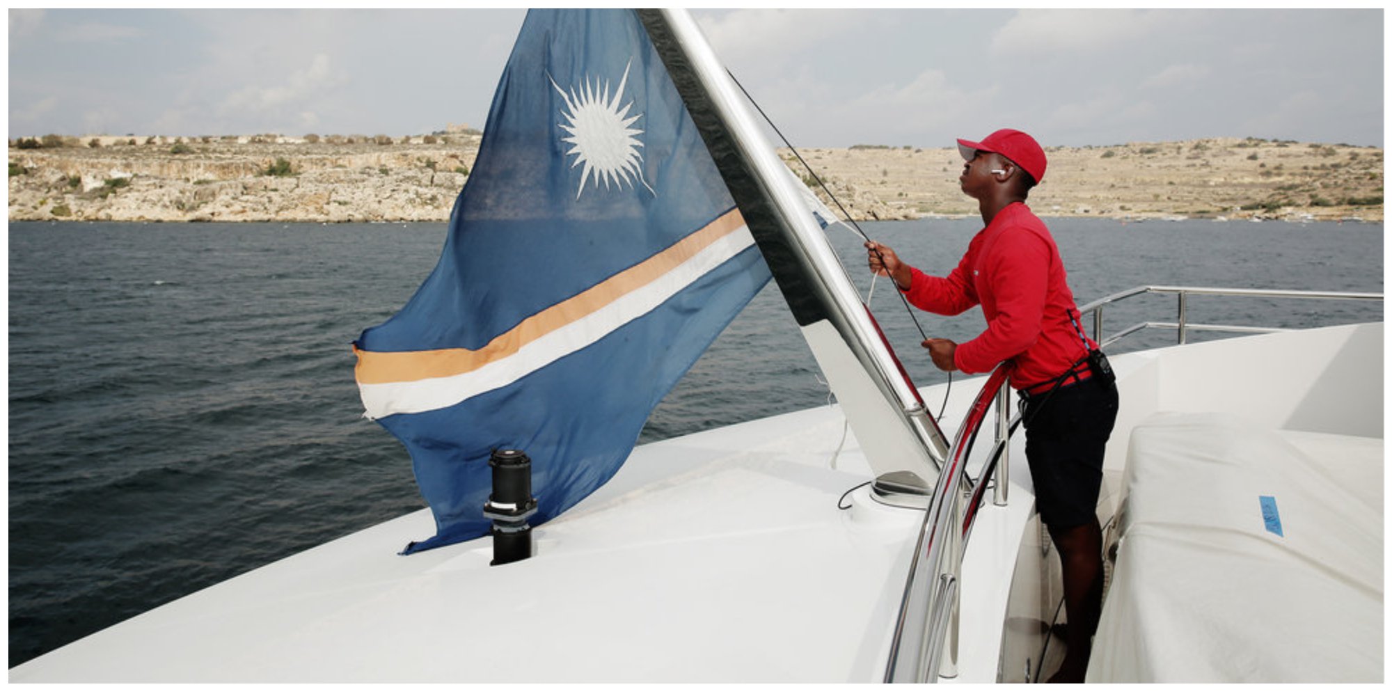 Mzi 'Zee' Dempers from raises the flag on a yacht on 'Below Deck Med'