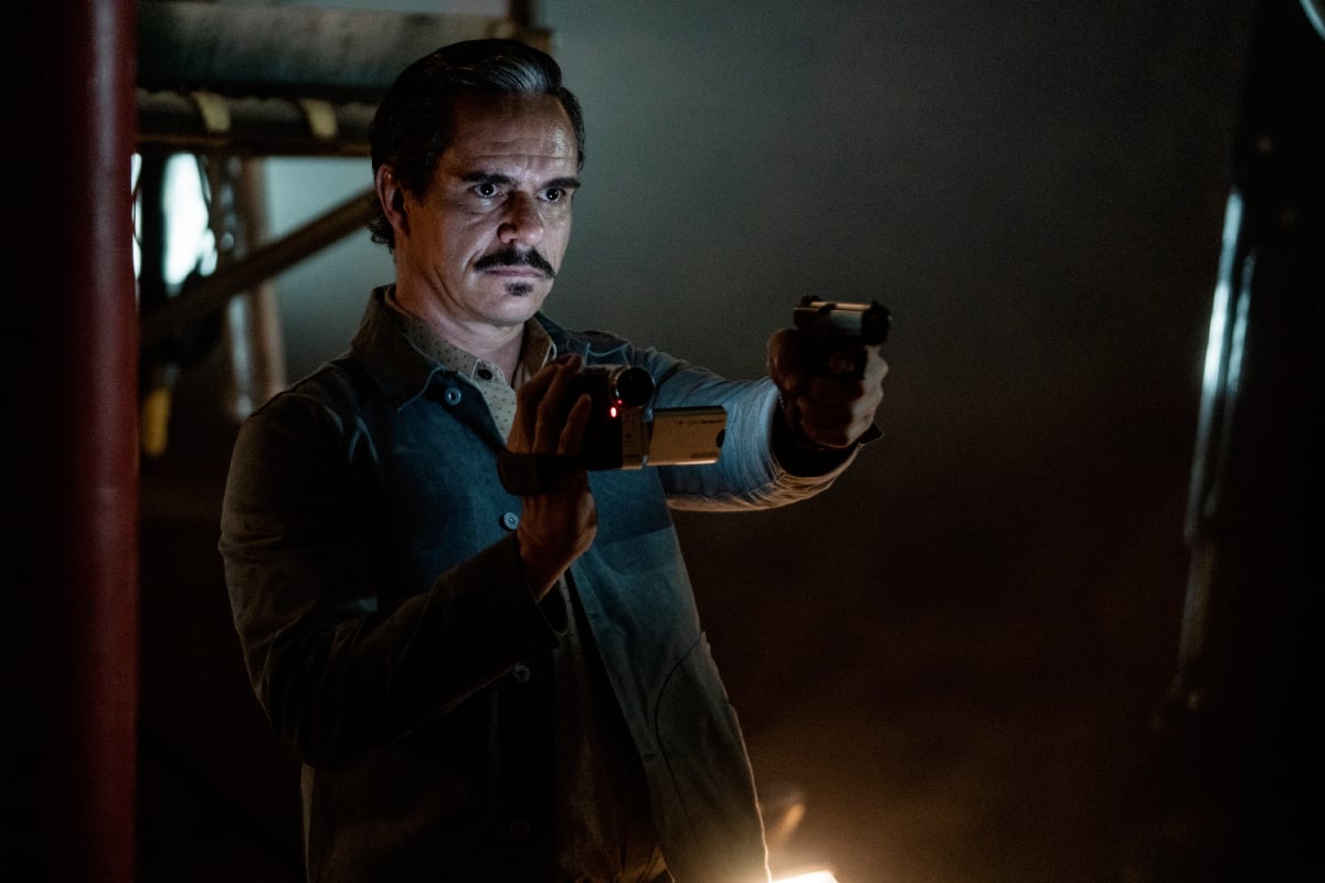 Tony Dalton as Lalo Salamanca in Better Call Saul Season 6 Episode 8. Lalo holds a gun and a video camera.