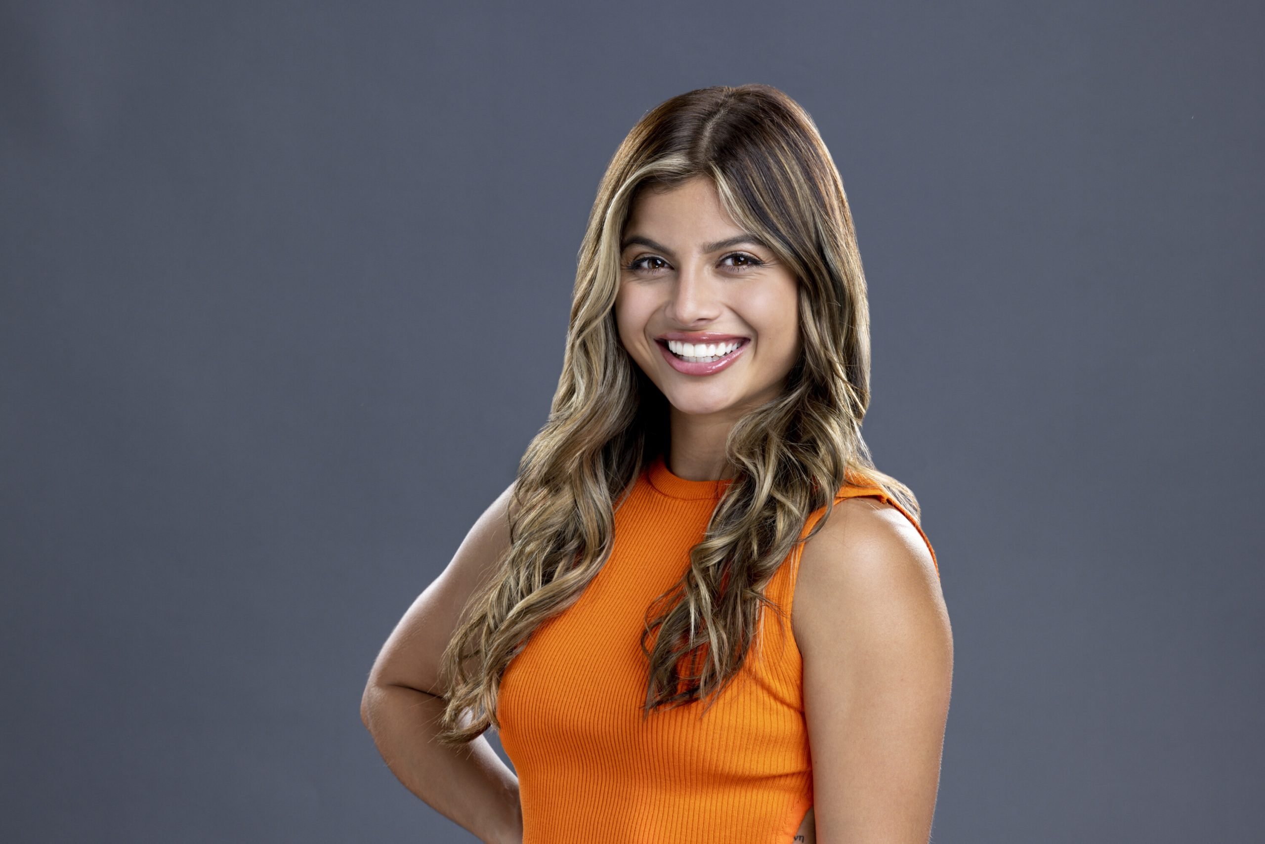 Paloma Aguilar, a houseguest in 'Big Brother 24,' wears an orange tank top.