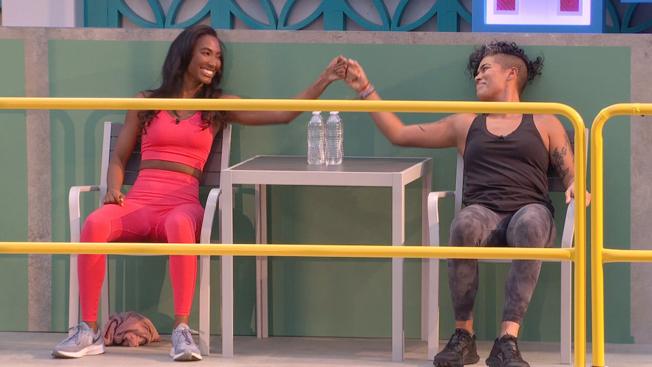 Taylor and Nicole fist bump sitting next to each other on 'Big Brother 24'.