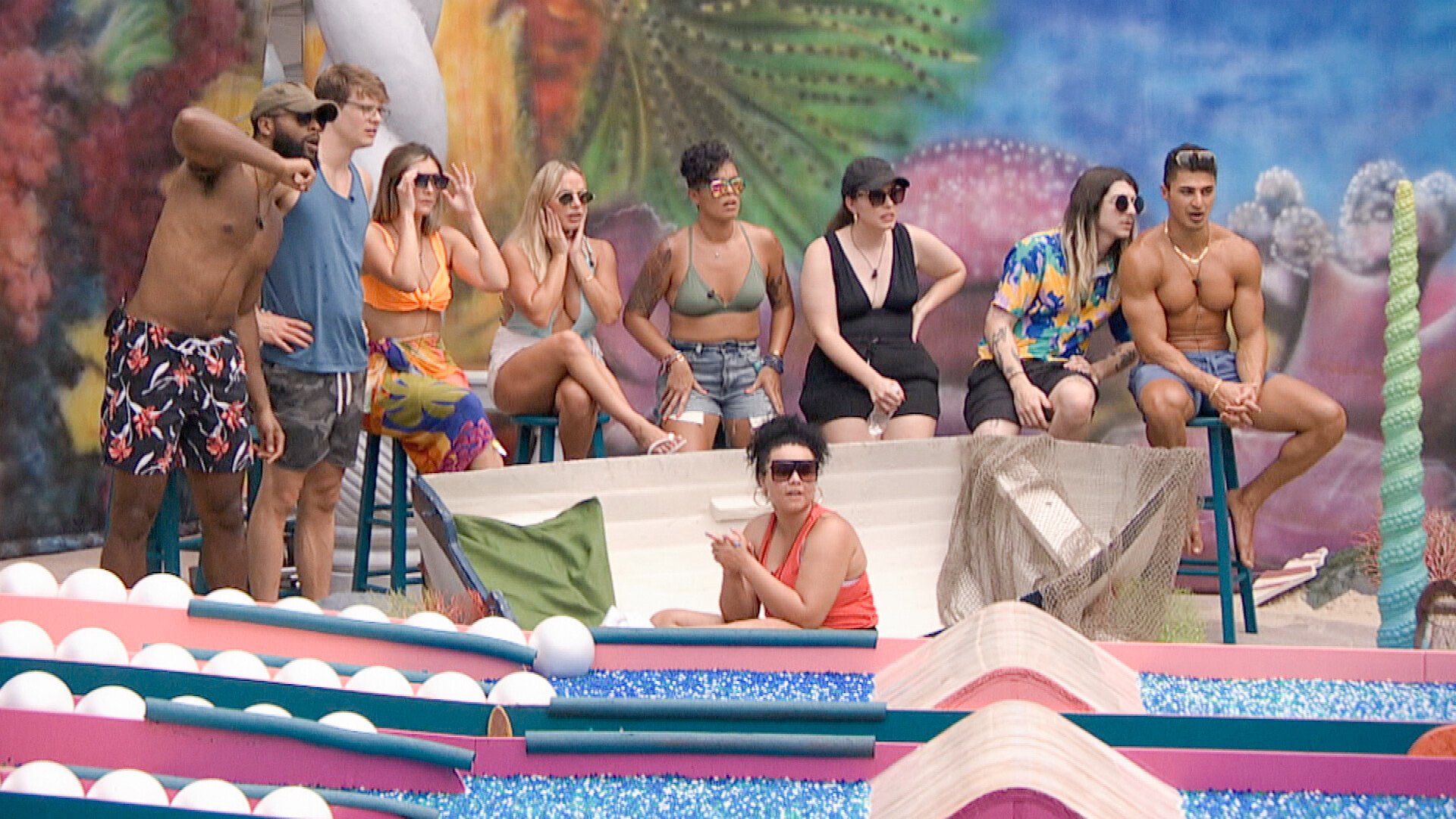 The Big Brother 24 cast sitting next to each other during a Power of Veto competition. Shows like Big Brother also use competitions.