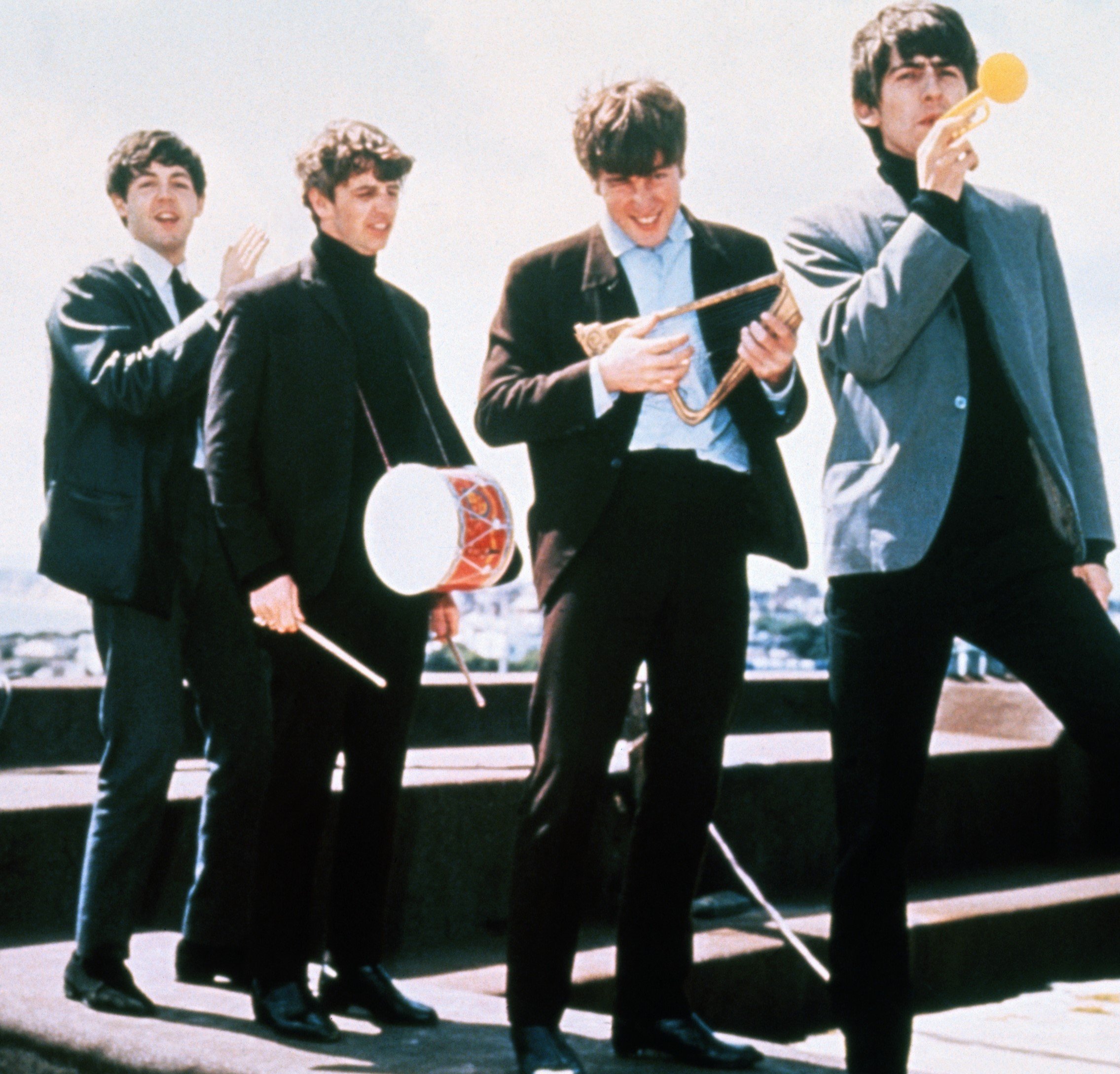 The Beatles' Paul McCartney, Ringo Starr, John Lennon, and George Harrison playing instruments during the 'Yesterday" era