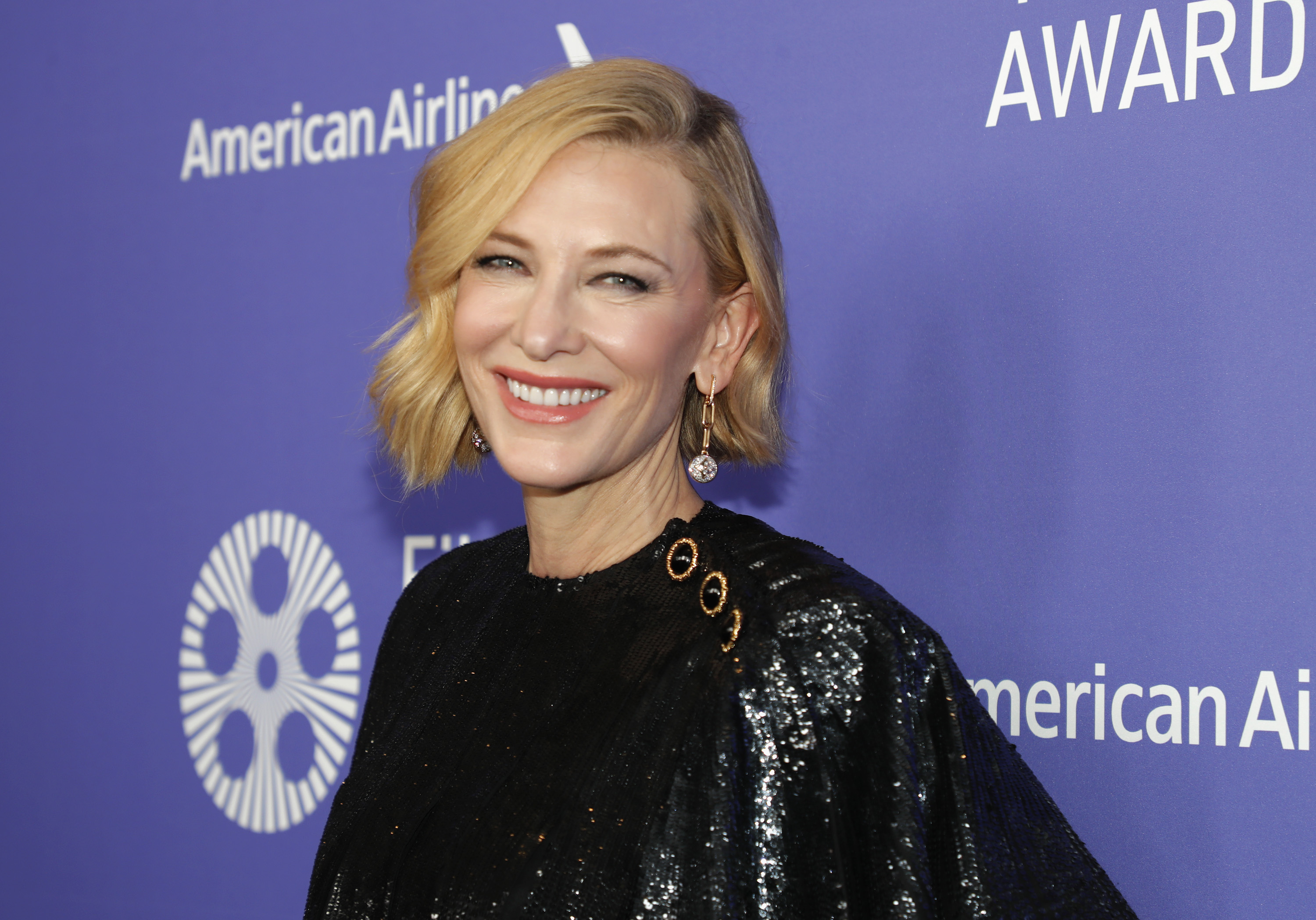 Smiling Cate Blanchett posing for a photo at the 47th Chaplin Awards Gala