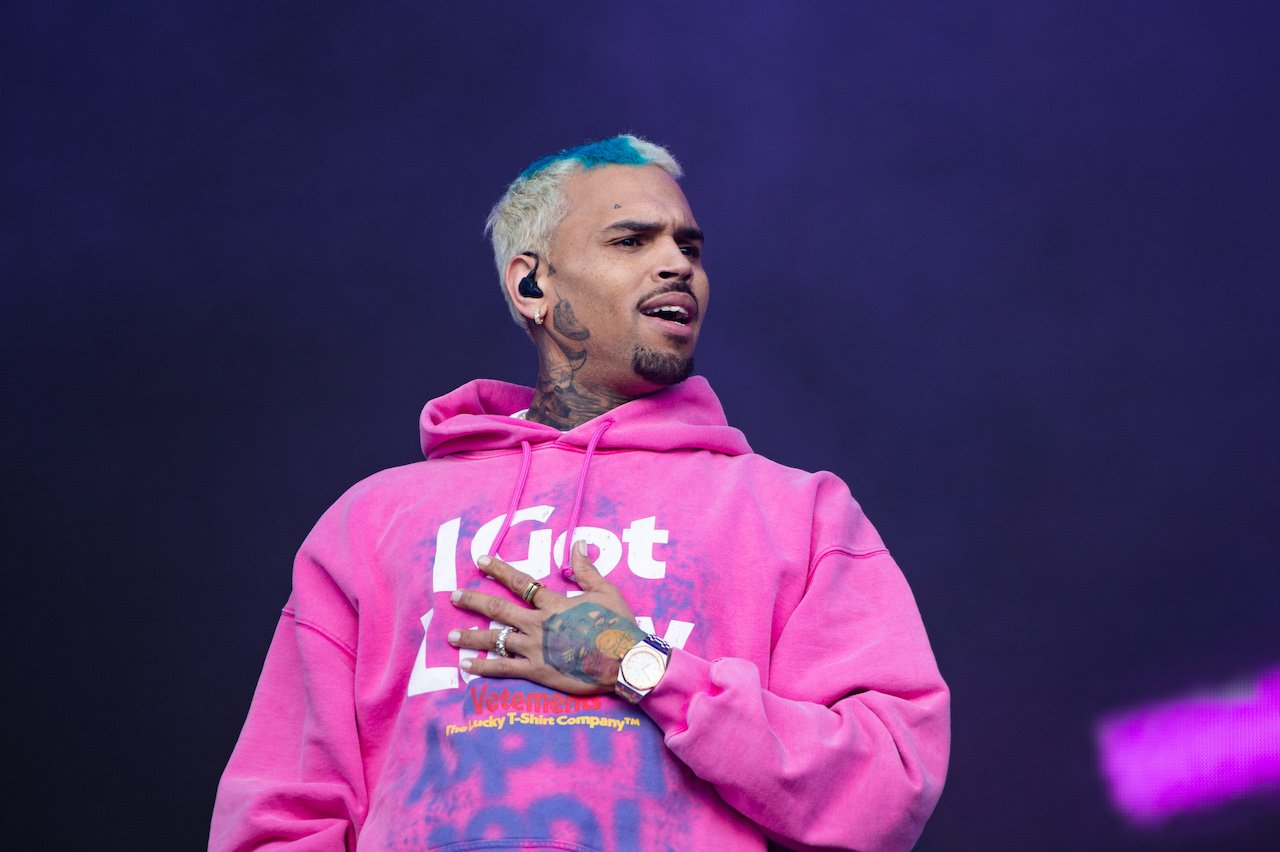 Chris Brown on stage; Brown is being sued for $1 million for backing out of a benefit concert
