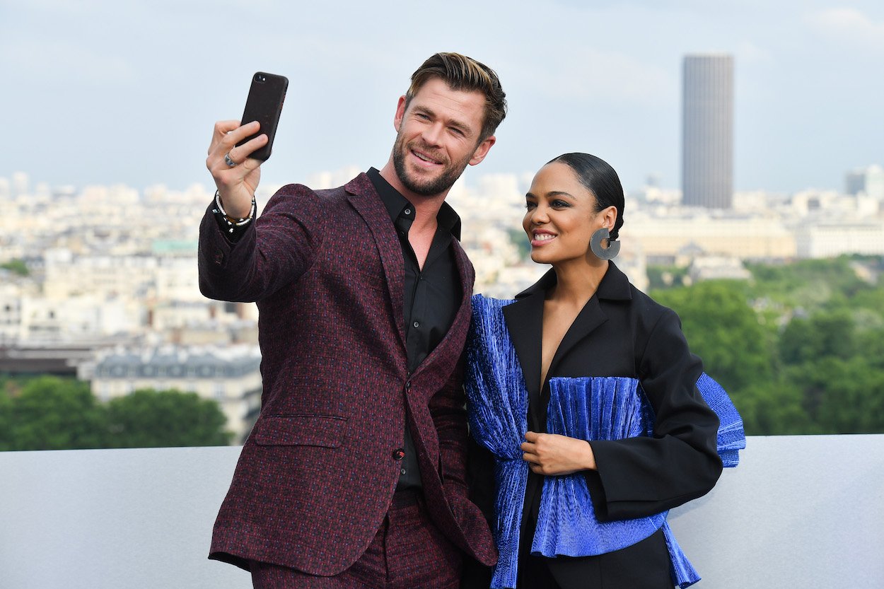 Chris Hemsworth and Tessa Thompson attend a 'Men in Black: International' event in Paris in 2019. Hemsworth and Thompson have starred in three movies together, including 2022's 'Thor: Love and Thunder.'