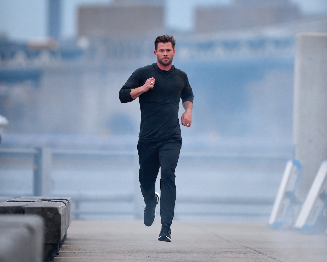 Chris Hemsworth jogs in Brooklyn in 2019. Hemsworth's diet and fitness routine keep him in shape, but his cheat foods in his self-described "80-20" diet are all too common.