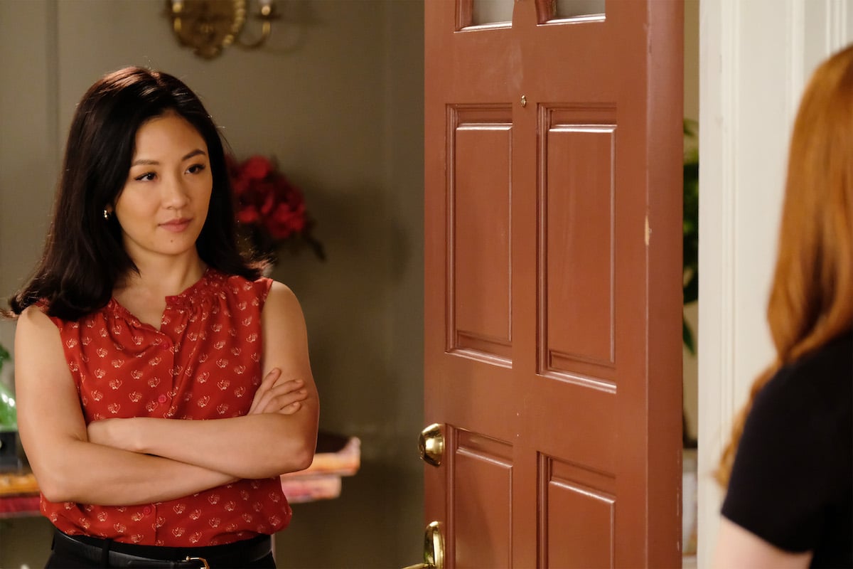 Constance Wu folds her arms in the doorway on 'Fresh Off the Boat'