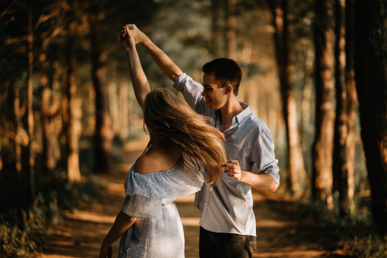 Couple twirling during a dance.