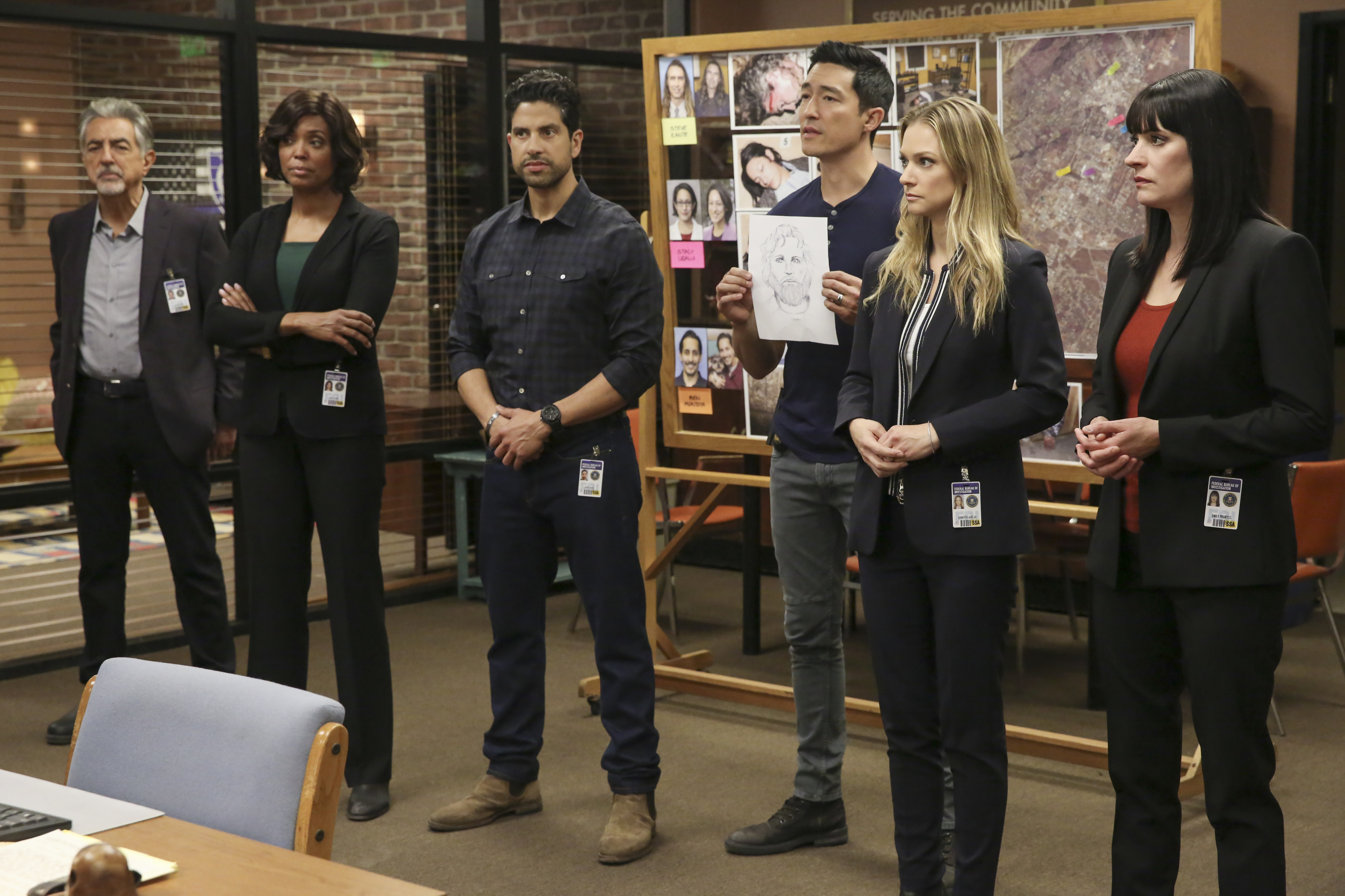 The Criminal Minds cast stands next to each other