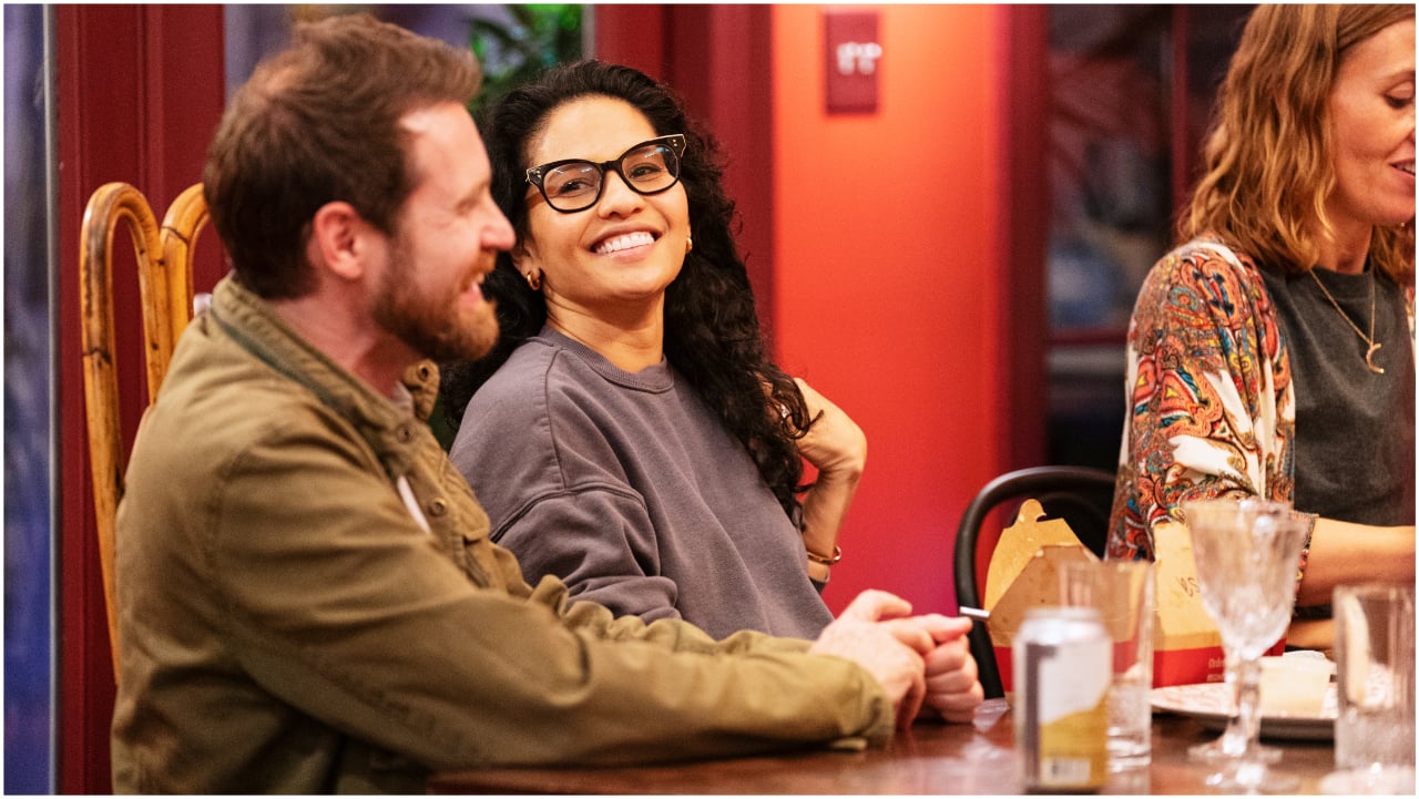 Danny Roberts, Melissa Beck, and Julie Stoffer sitting at a table and laughing during 'The Real World: Homecoming'