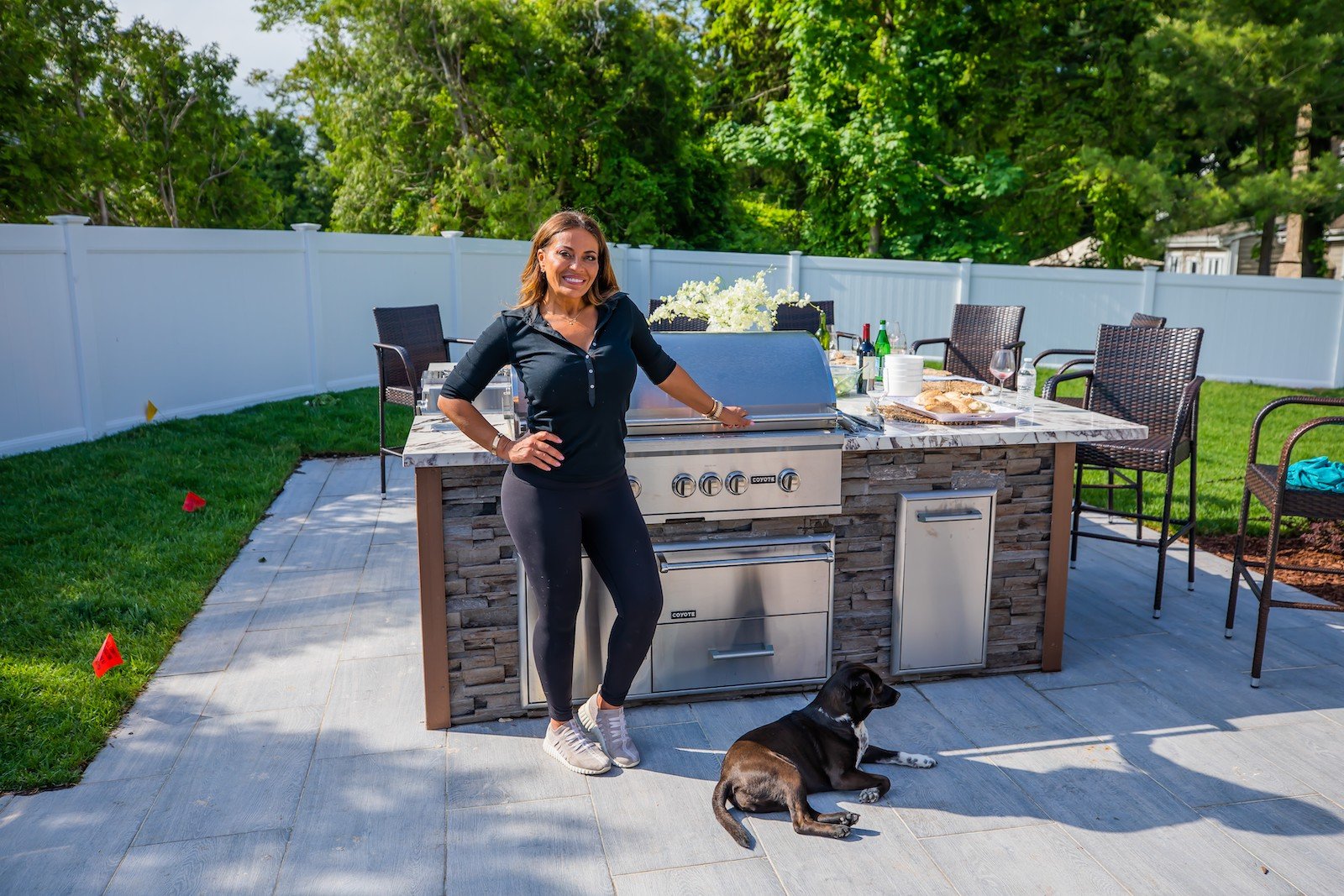 Dolores Catania from 'RHONJ' stands next to her outdoor kitchen in her backyard