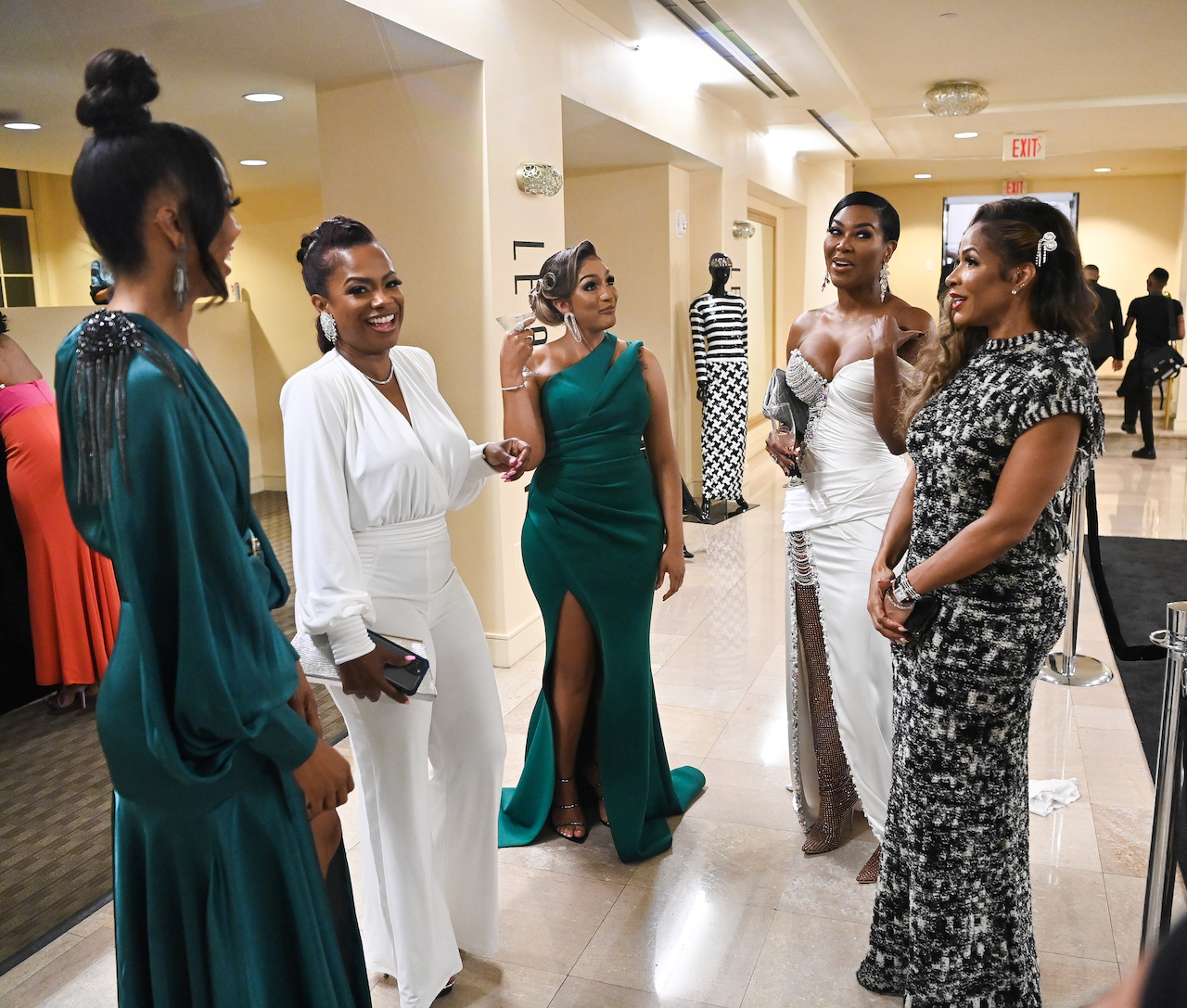 Drew Sidora and Sheree Whitfield with 'RHOA' cast members Kenya Moore and Kandi Burruss; Whitfield says Sidora and her husband are fradulent