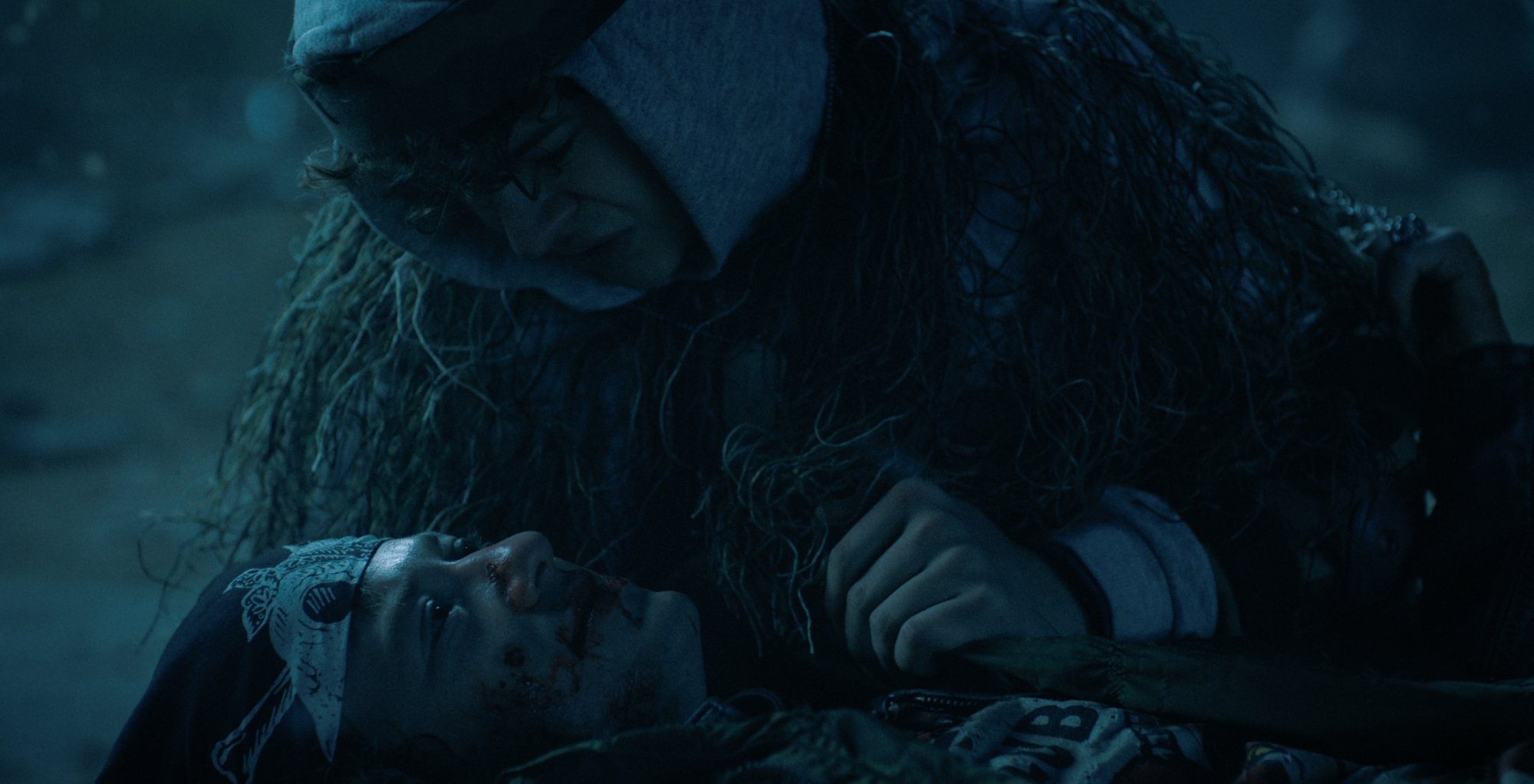 Dustin holding Eddie during his death in 'Stranger Things' 4.