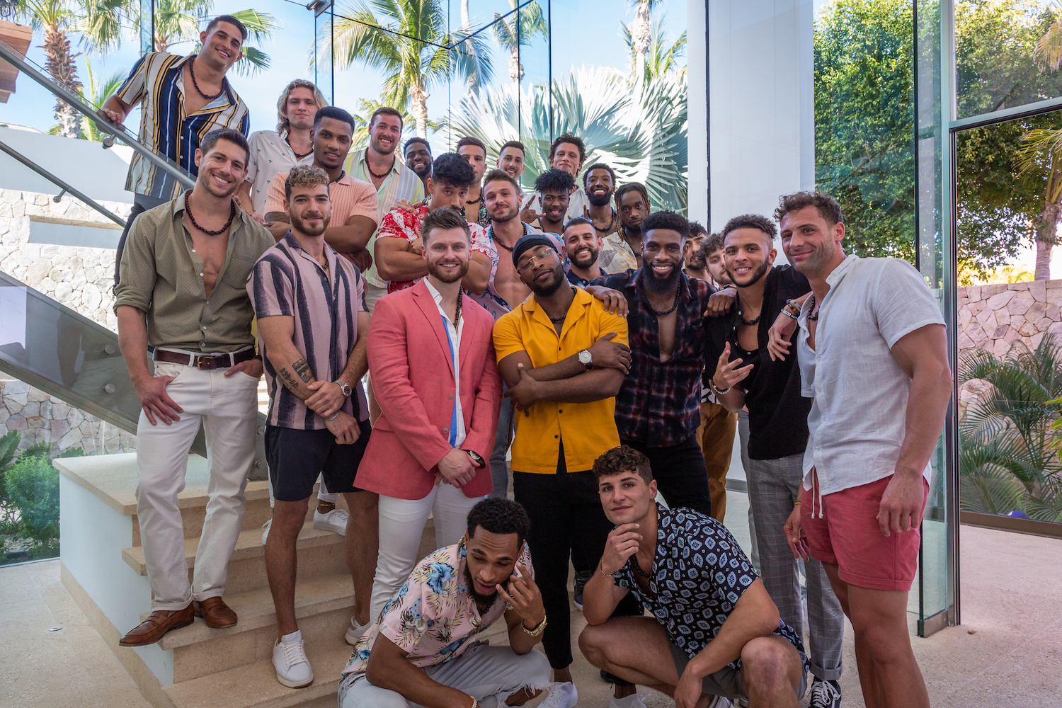 'FBoy Island' Season 2 men standing in a group outside the mansion.