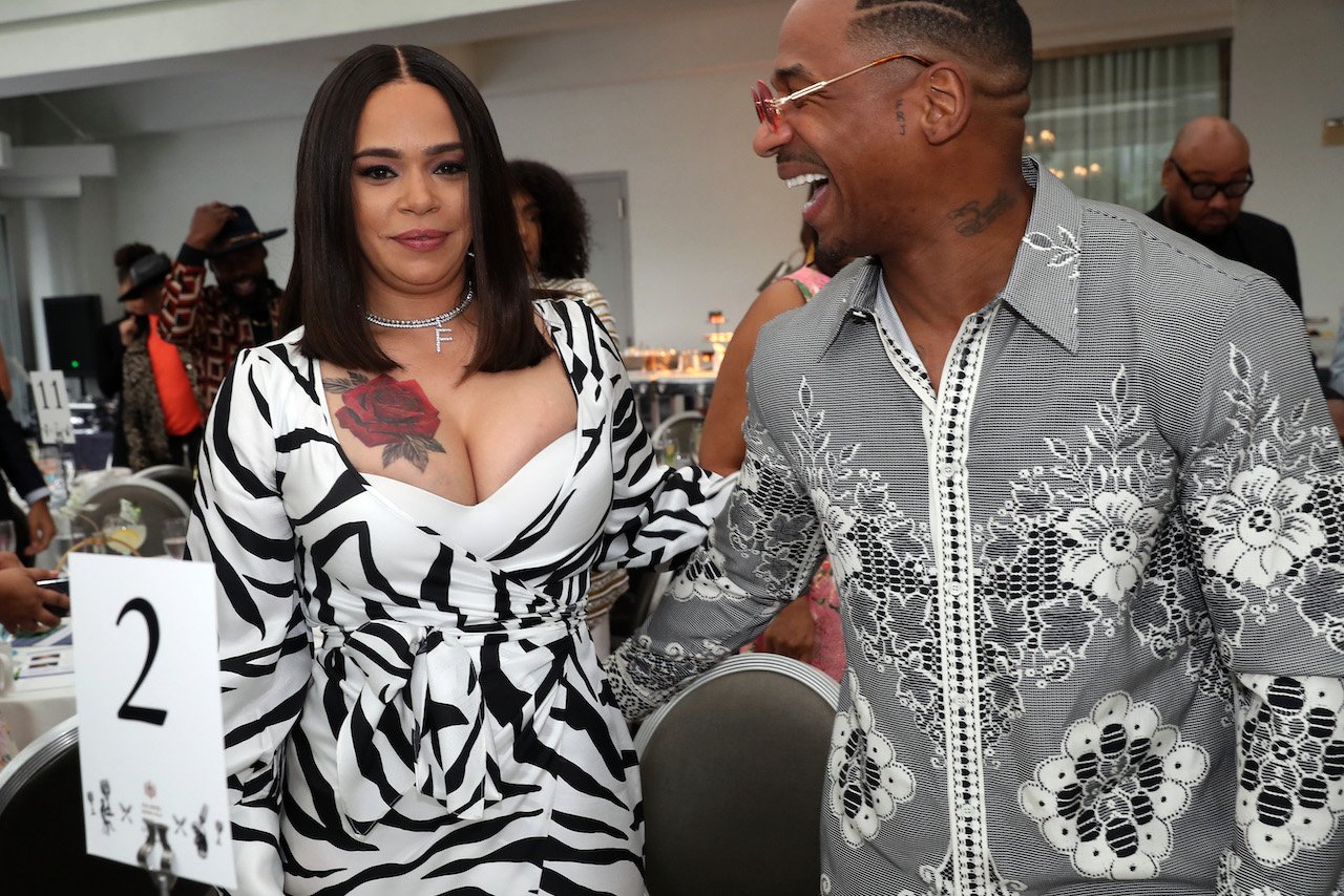 Faith Evans and Stevie J post for photo at event; Evans and Stevie sparked reconciliation rumors after spending the Fourth of July holiday together
