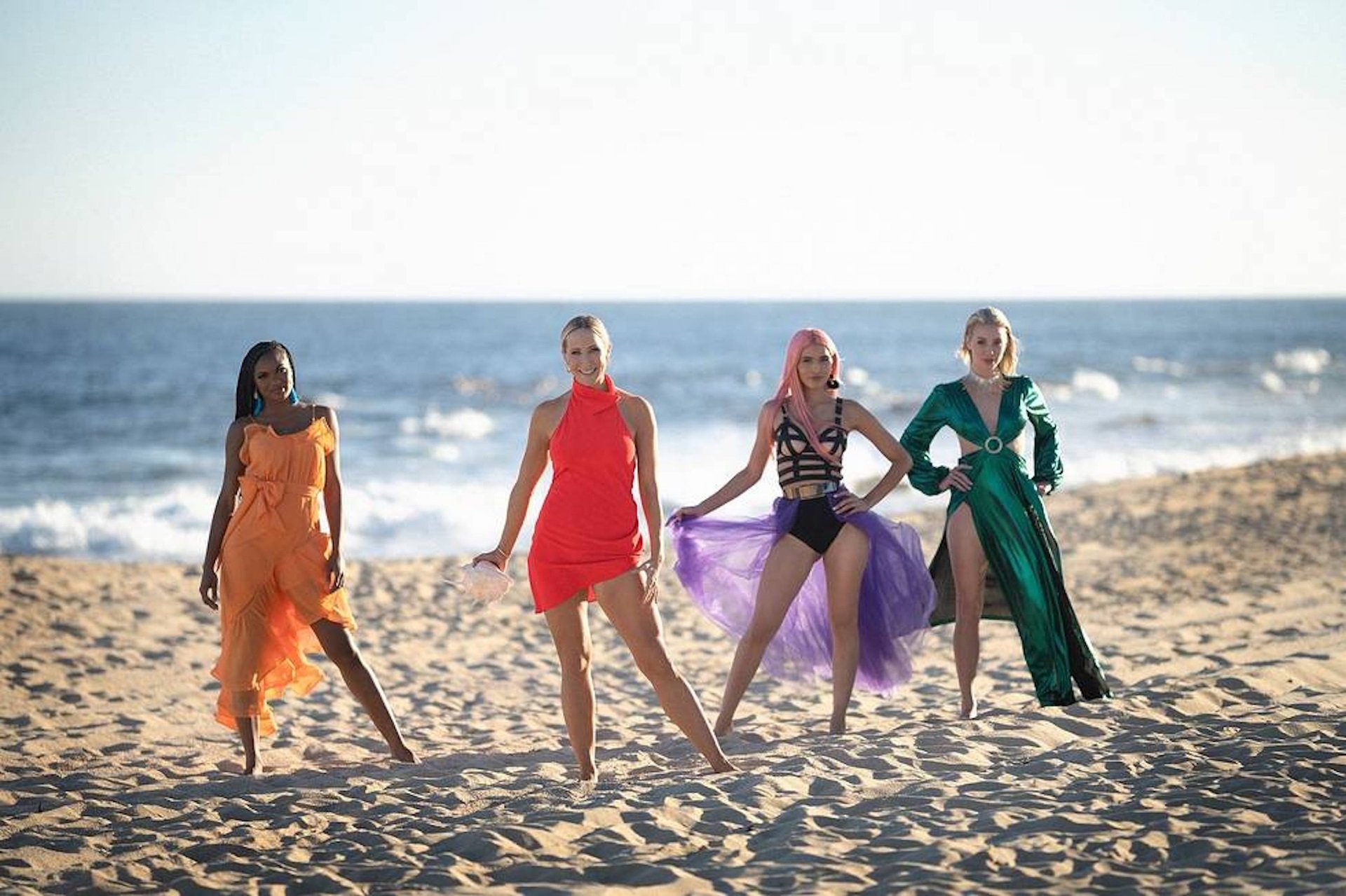 'FBoy Island' Season 2 contestants with the host, Mia Emani Jones, Nikki Glaser, Tamaris Sepulveda, Louise Barnard posing on the beach