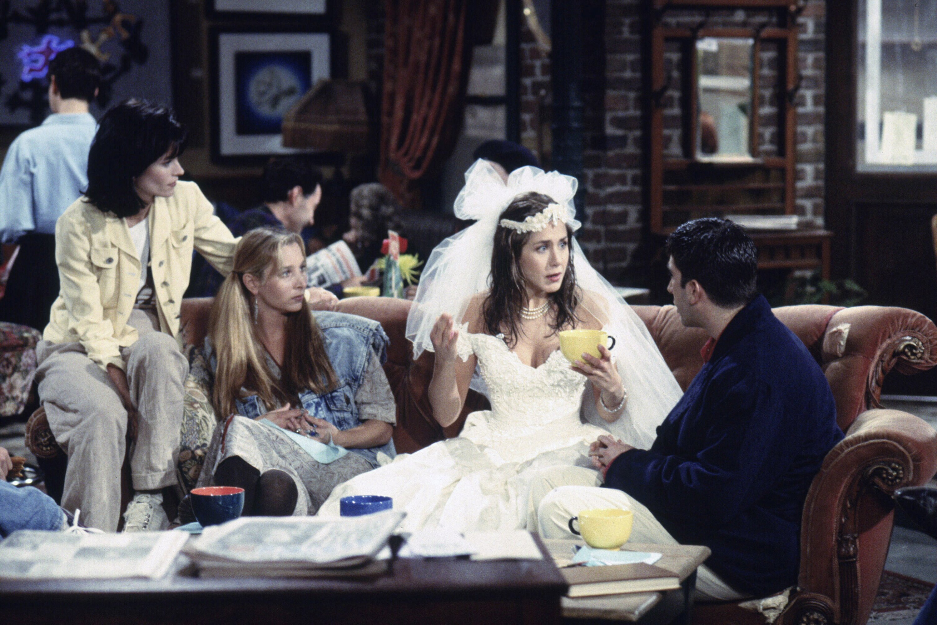 A scene from the pilot episode of friends, featuring Ross and Rachel, Monica and Phoebe