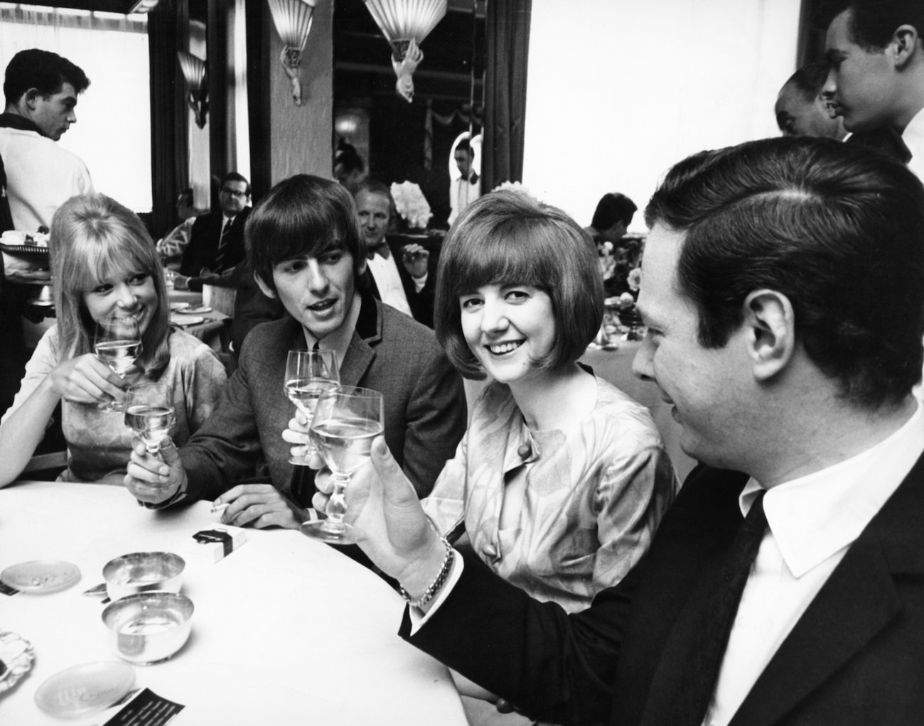 George Harrison and Pattie Boyd with The Beatles' manager, Brian Epstein and Cilla Black in 1964.