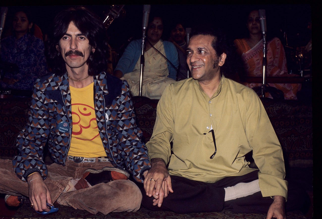 George Harrison and Ravi Shankar siting in the 1970s.