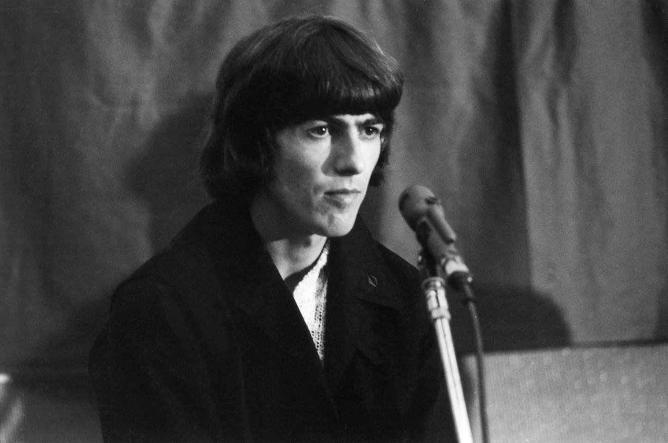 George Harrison at a press conference for the release of 'Help!' in 1965.