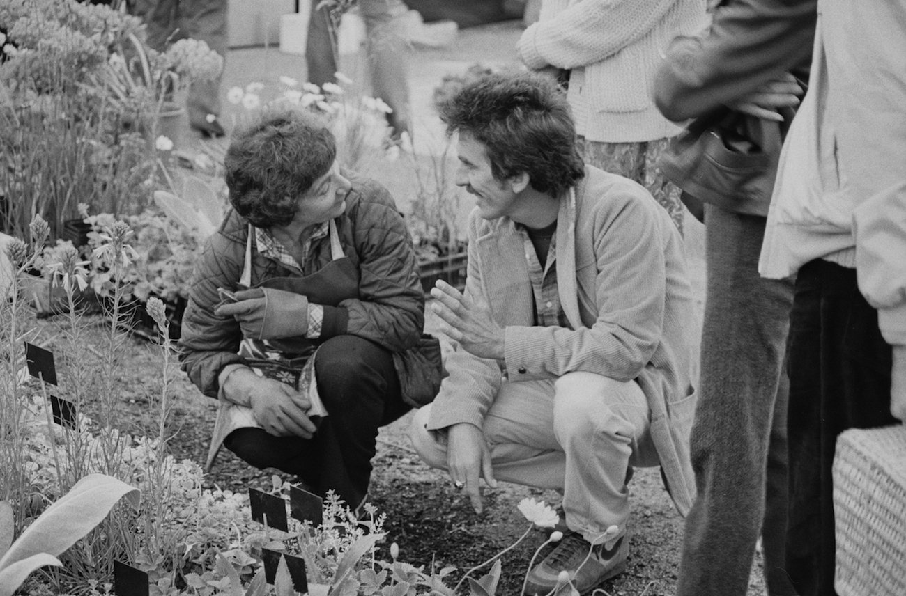 George Harrison looking at a garden at the Chelsea Flower Show in 1984.