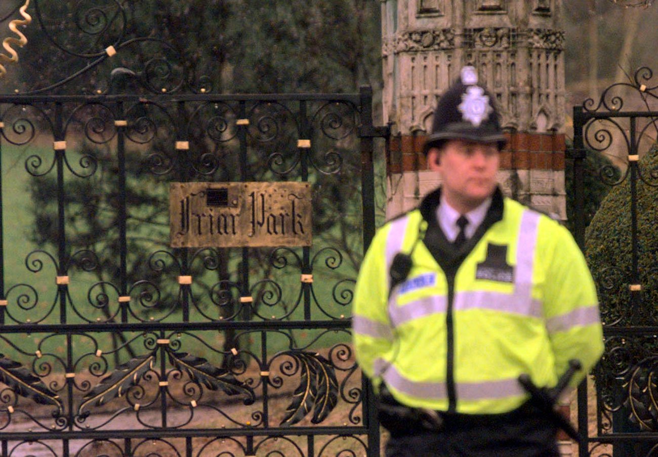 Police guarding George Harrison's home, Friar Park, following a home invasion in 1999.