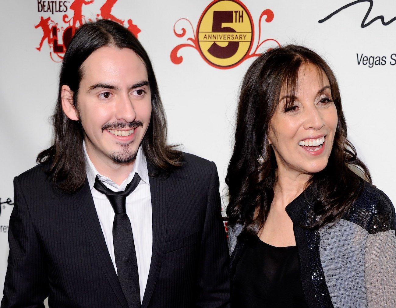 George Harrison's wife, Olivia, with their son, Dhani, at the celebration of the fifth anniversary of 'The Beatles LOVE BY Cirque du Soleil' in 2011.