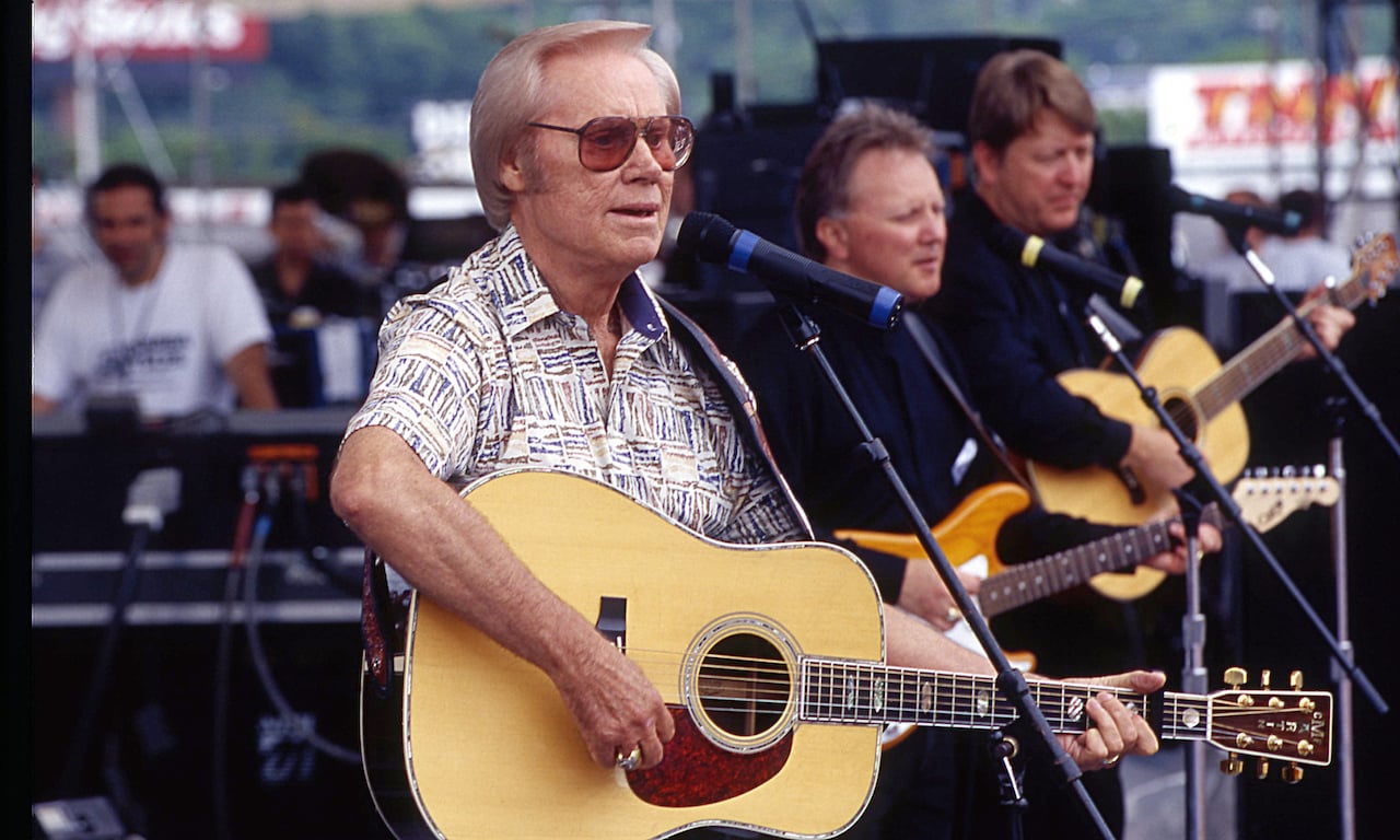 George Jones, shown performing in 1999, joined the Marines to avoid more time in jail