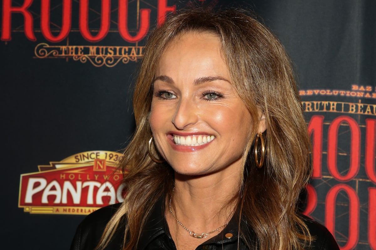 Giada De Laurentiis, who has a pan-seared salmon recipe, smiles and looks on while walking the red carpet