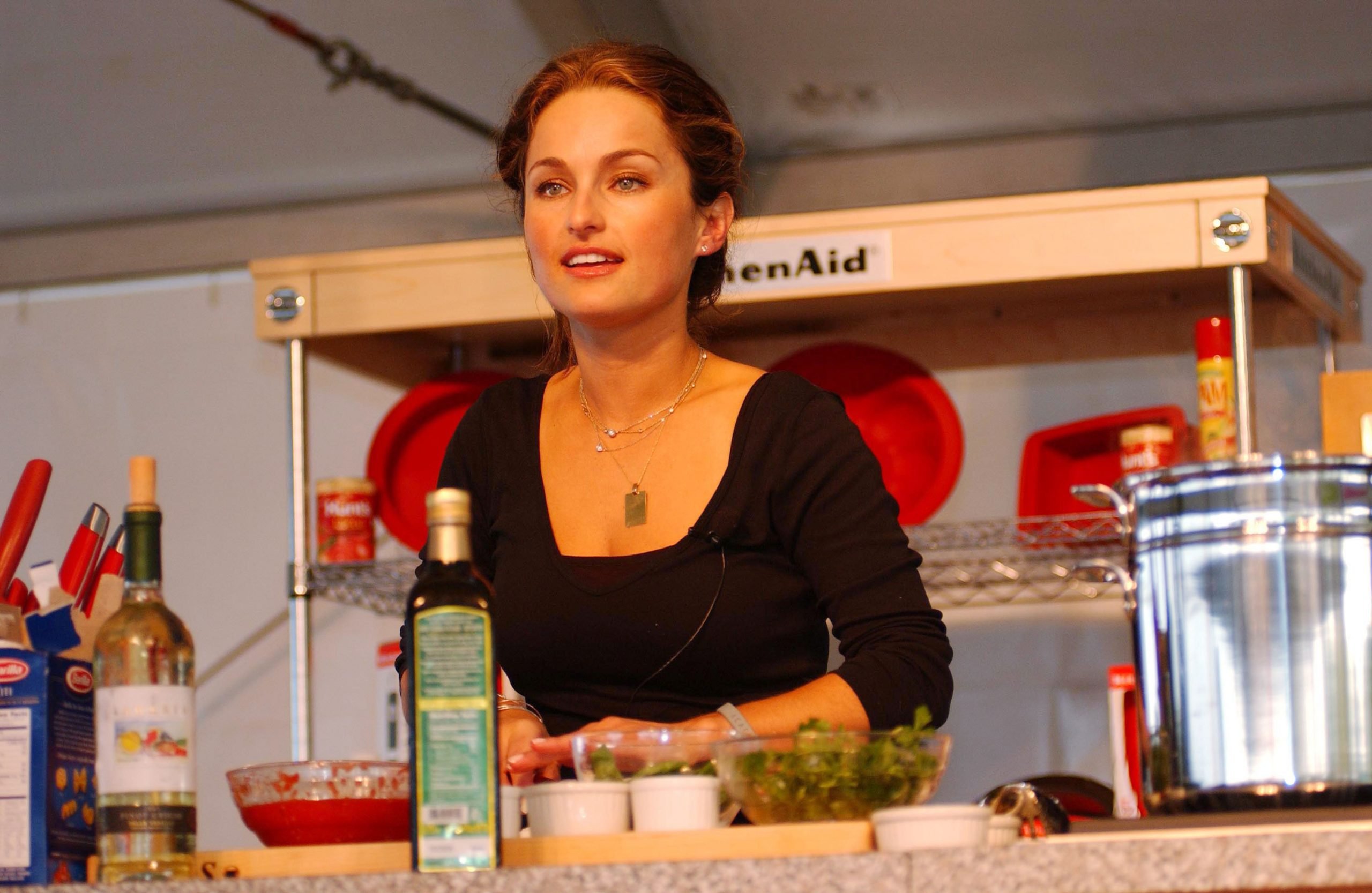 Giada De Laurentiis wears a black blouse in this photograph.