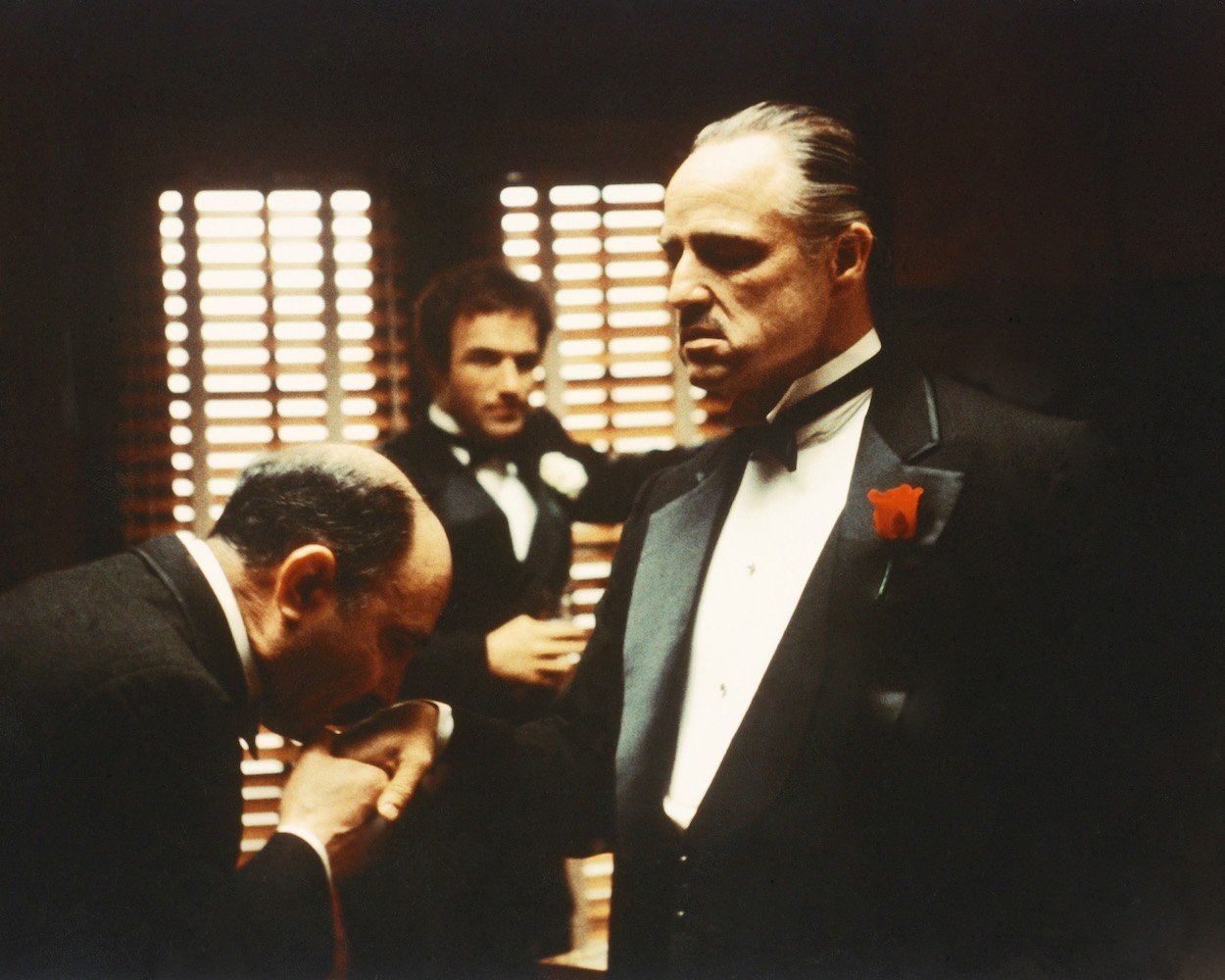 Salvatore Corsitto (from left), James Caan, and Marlon Brando inside 'The Godfather' mansion in the first movie. For the right price, anyone can book an Airbnb stay at 'The Godfather' mansion that featured so prominently in the movie.