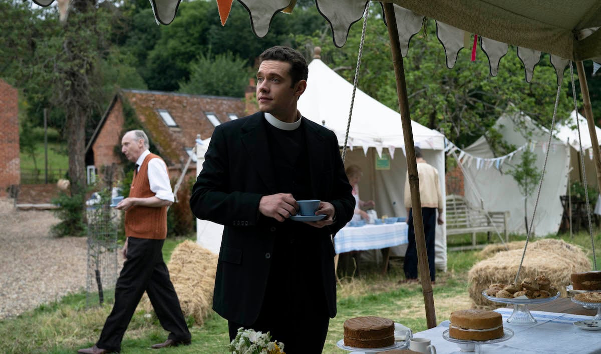 Tom Brittney as Will, holding a cup of tea, in 'Grantchester' Season 7
