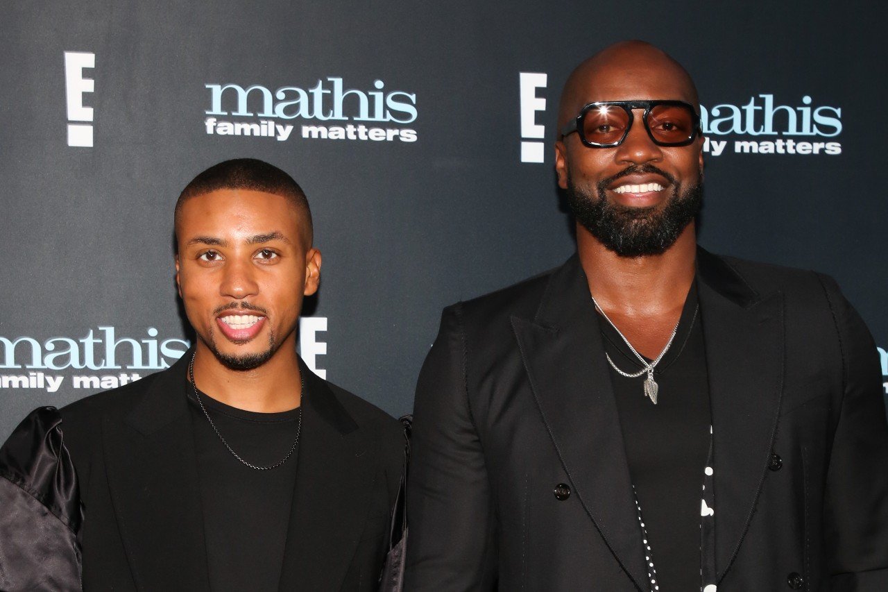 Greg Mathis Jr. poses with boyfriend Elliott Cooper during a party for Mathis Family Matters.