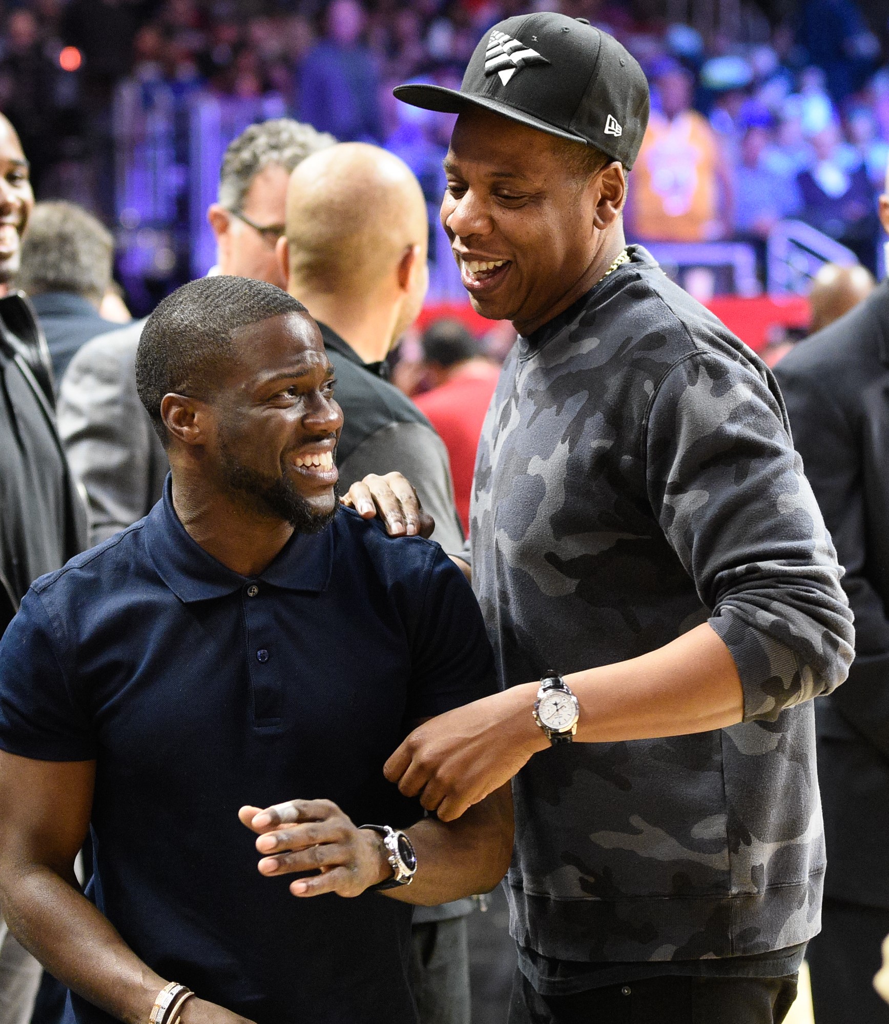 Jay-Z and Kevin Hart share a laugh at a basketball game between the Oklahoma City Thunder and the Los Angeles Clippers