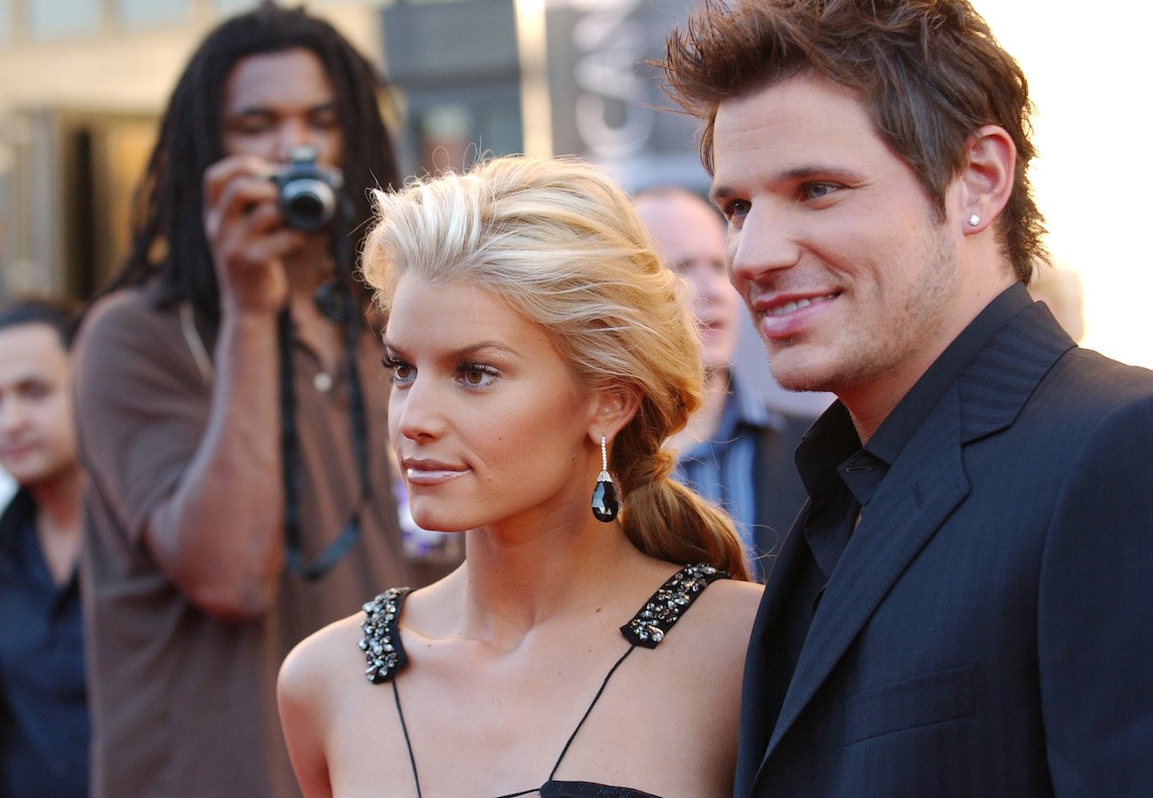 Jessica Simpson and Nick Lachey pose on red carpet; Simpson says she started her clothing line amid divorce from Lachey and 'Newlyweds' ending
