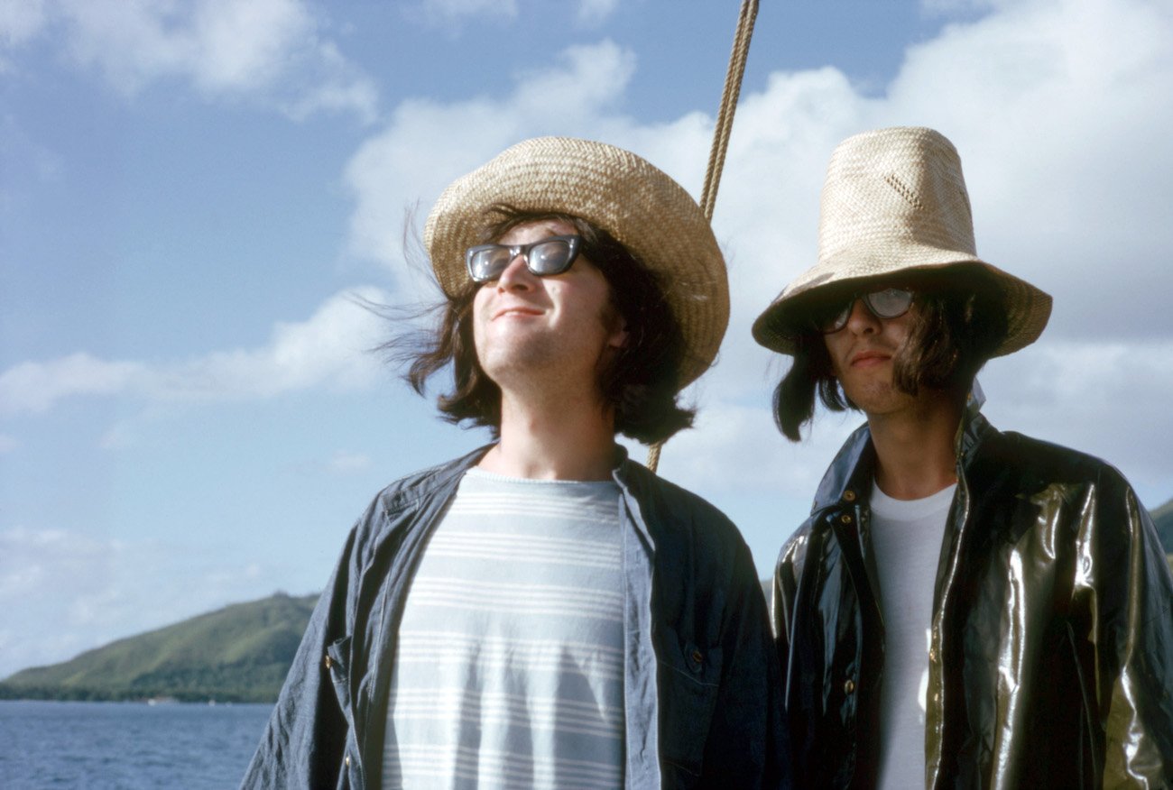 John Lennon and George Harrison vacationing in Tahiti in 1964.
