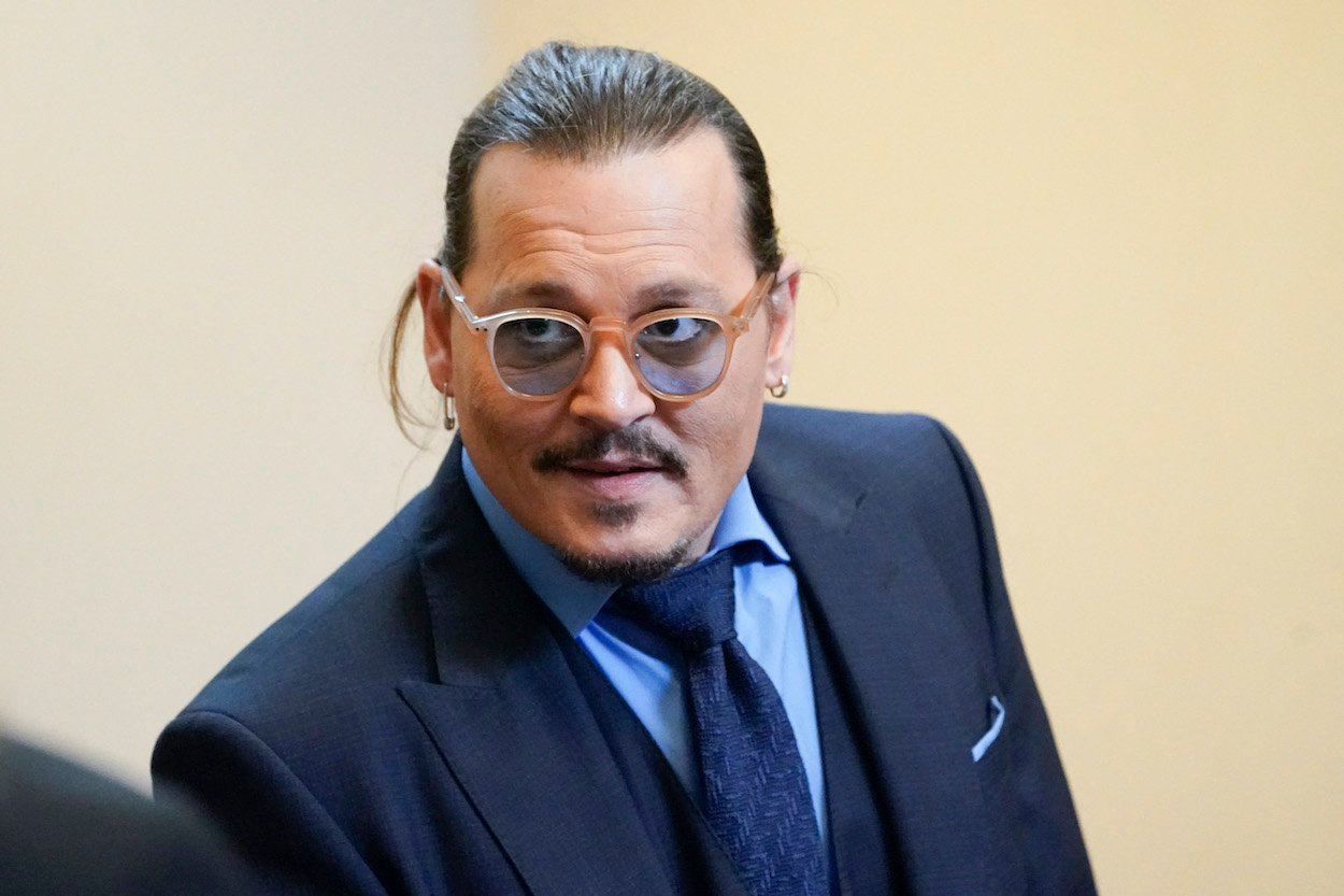 Johnny Depp in the courtroom in Fairfax, Virginia, during his defamation trial against Amber Heard. After that trial, Depp settled a lawsuit brought against him by a crew member who claimed Depp hit him while filming 'City of Lies."