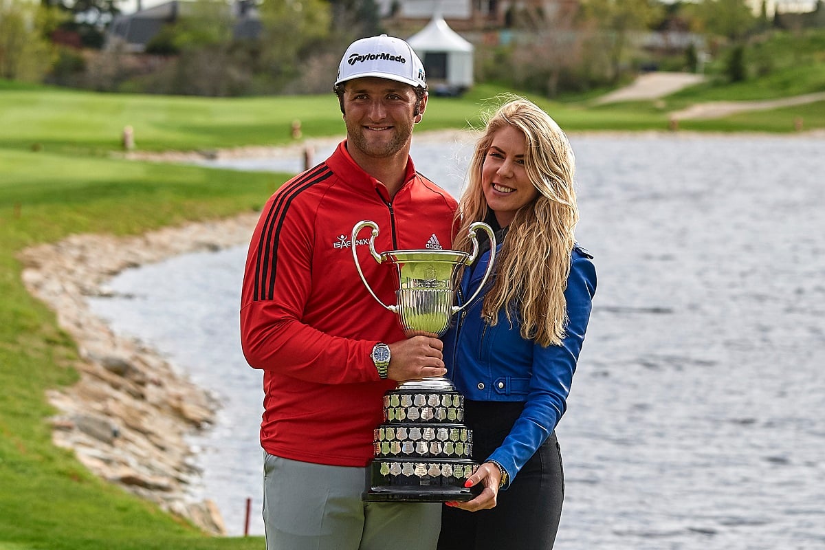 Jon Rahm and his wife, Kelley Cahill, pose with trophy after he won the Open de Espana