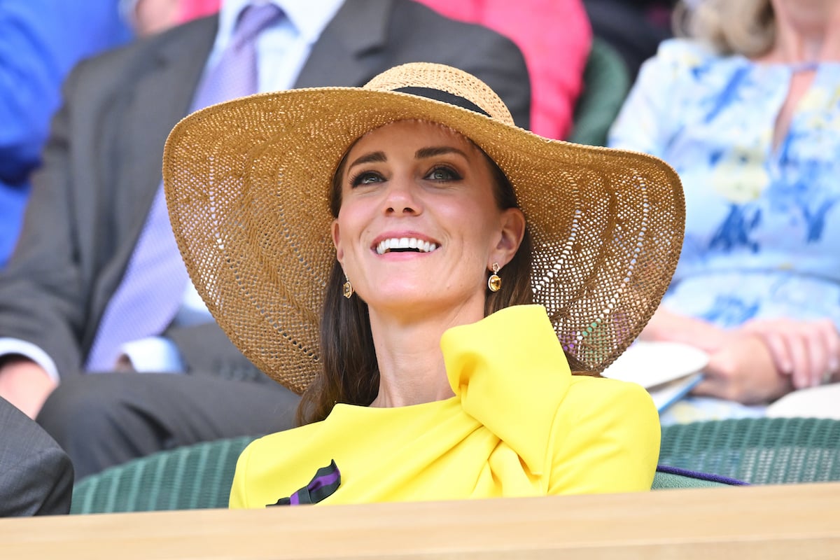 Kate Middleton wears a hat at Wimbledon and looks on