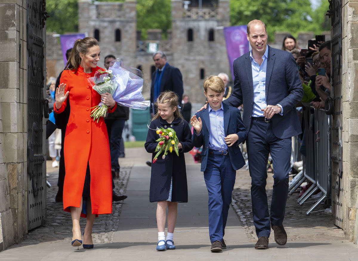 Kate Middleton and Prince William walk with Princess Charlotte and Prince George, who, according to a report, told a dog walker his name was Archie