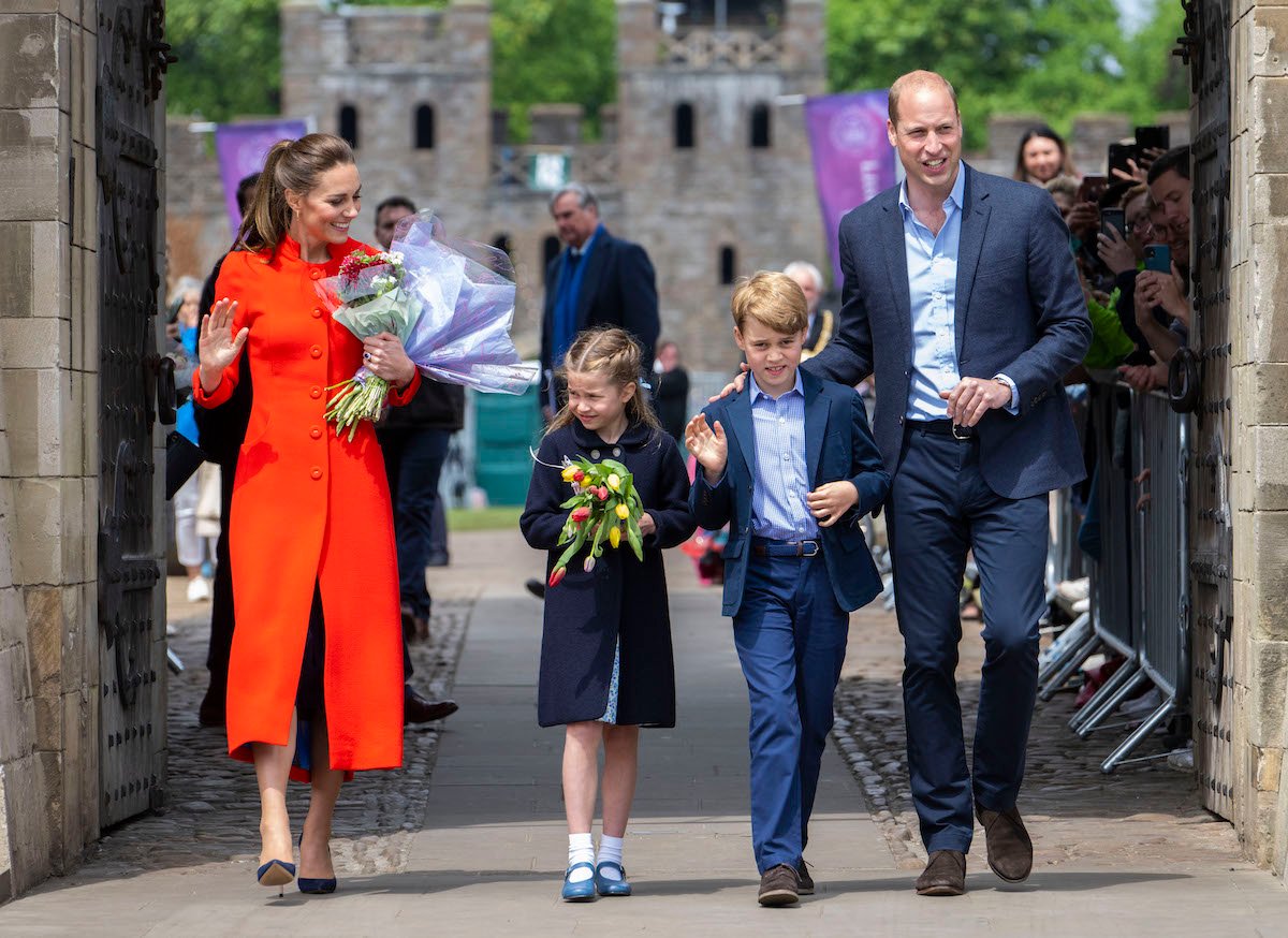 Kate Middleton and Prince William walk with Princess Charlotte and Prince George, who, according to a report, told a dog walker his name was Archie