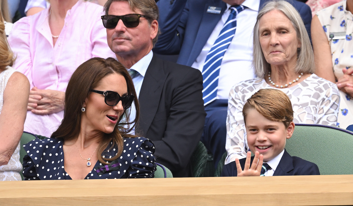 Kate Middleton sits next to Prince George at Wimbledon in what a body language expert called a 'strategic move' by Kate Middleton and Prince William